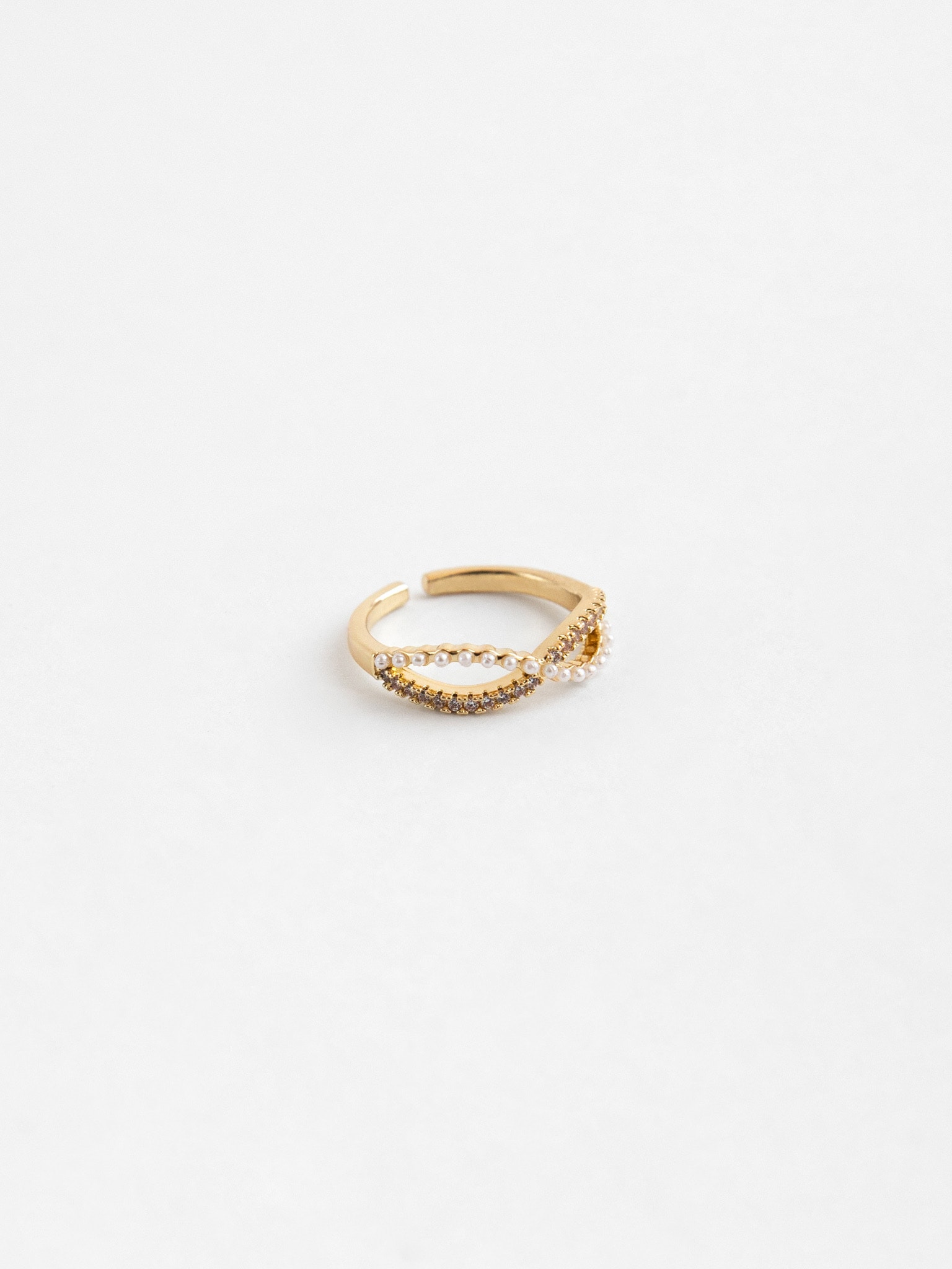 Criss-crossing encrusted ring