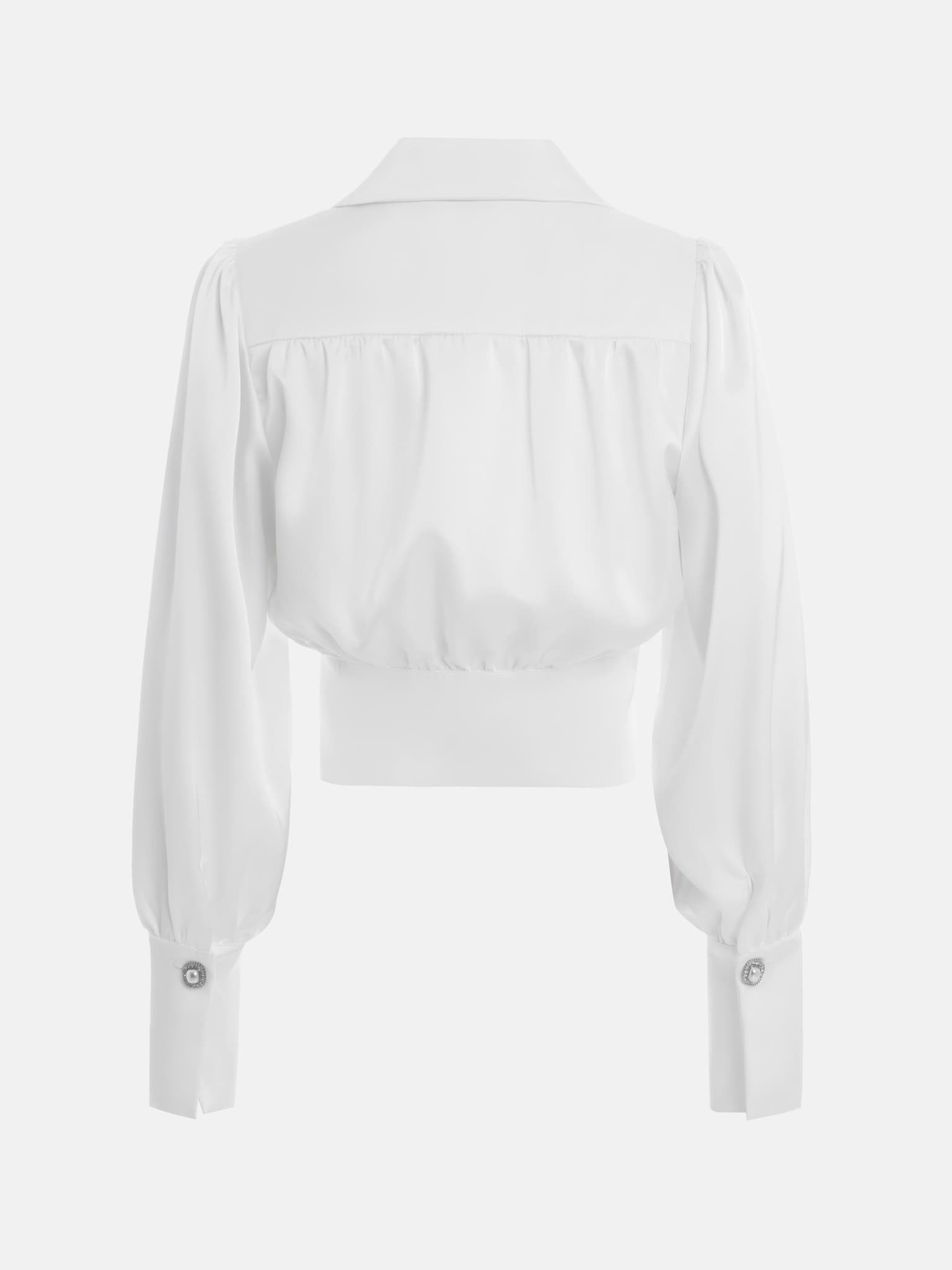 Blouse with a prominent waistband and sophisticated pearl buttons ...