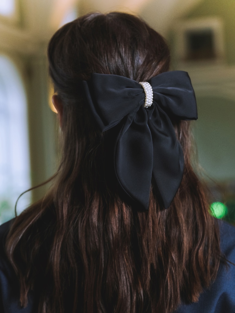 Satin hair bow with pearl decor