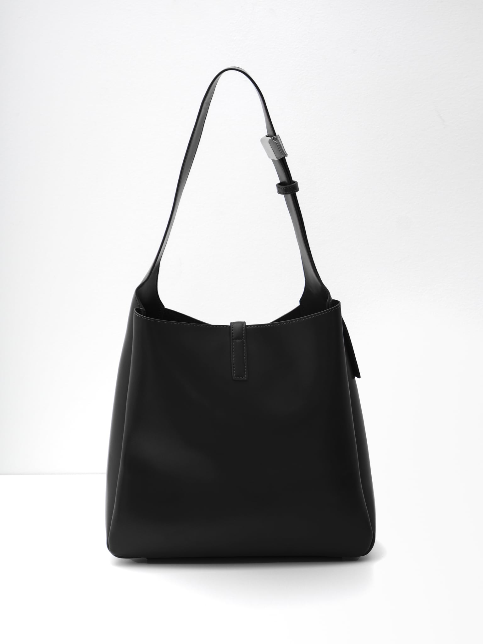 Square hard bag with a wide shoulder strap