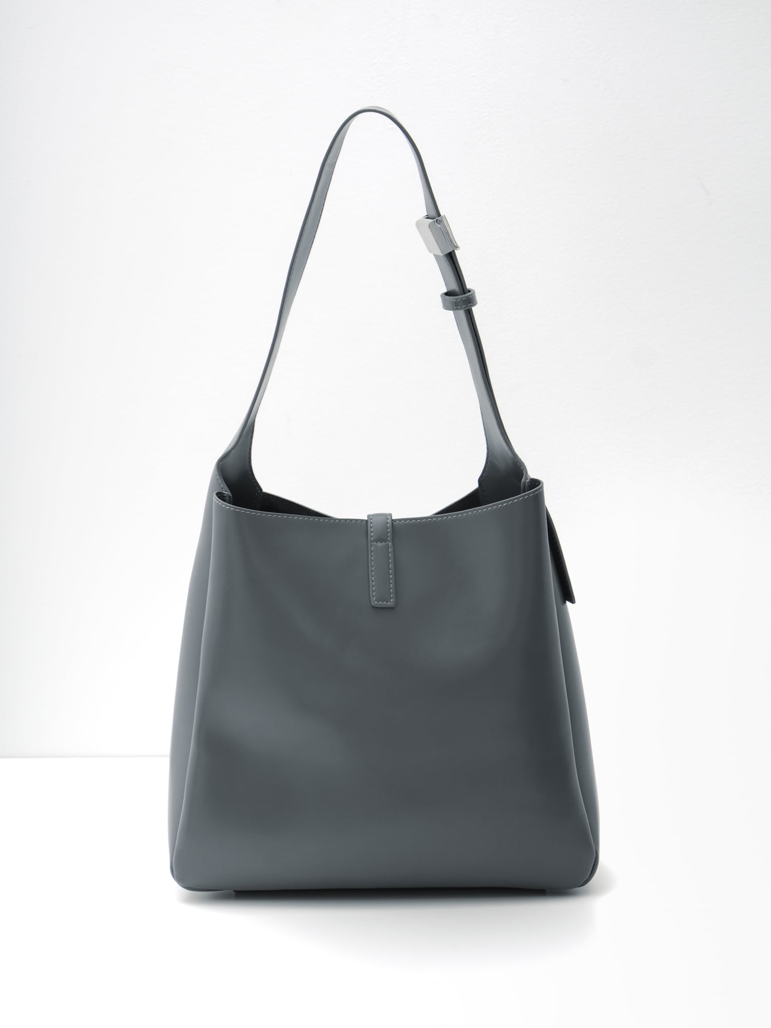 Square hard bag with a wide shoulder strap