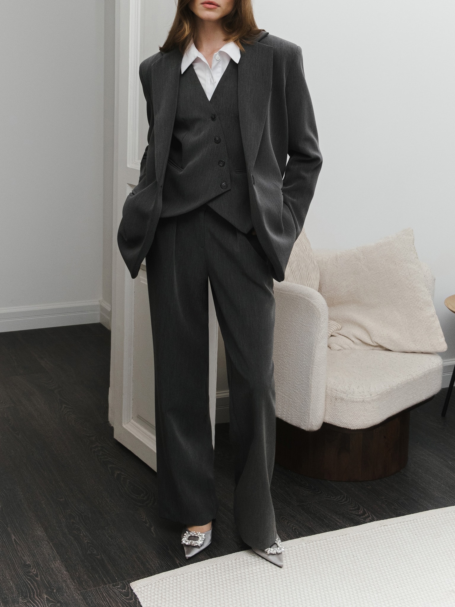 Vest with asymmetrical buttons in suiting fabric