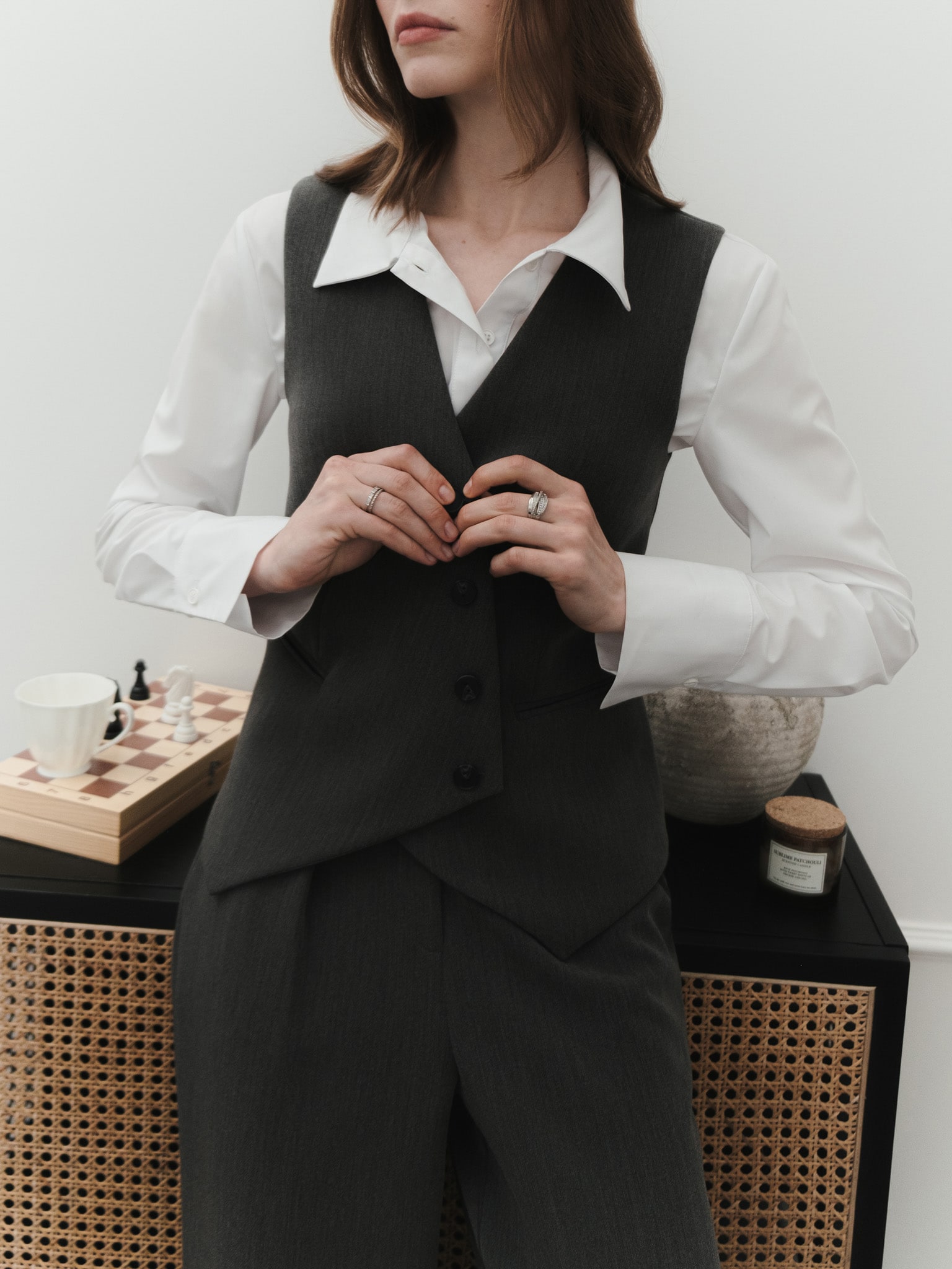 Vest with asymmetrical buttons in suiting fabric