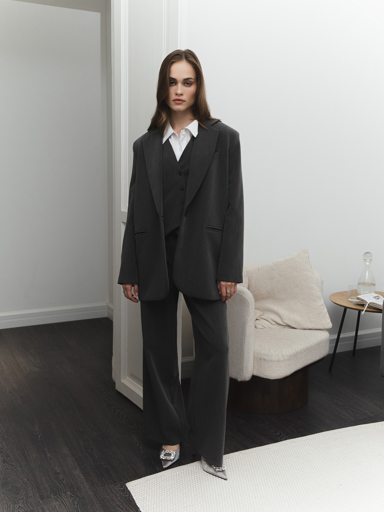 Vest with asymmetrical buttons in suiting fabric