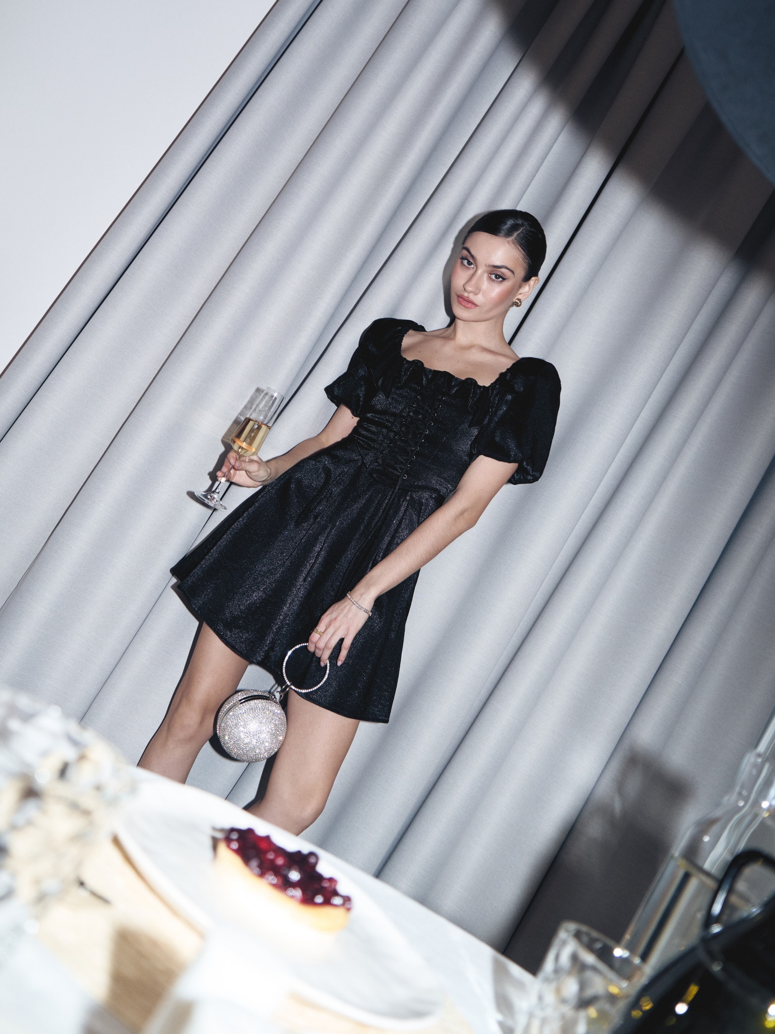 Shiny mini dress with lace-up waistline