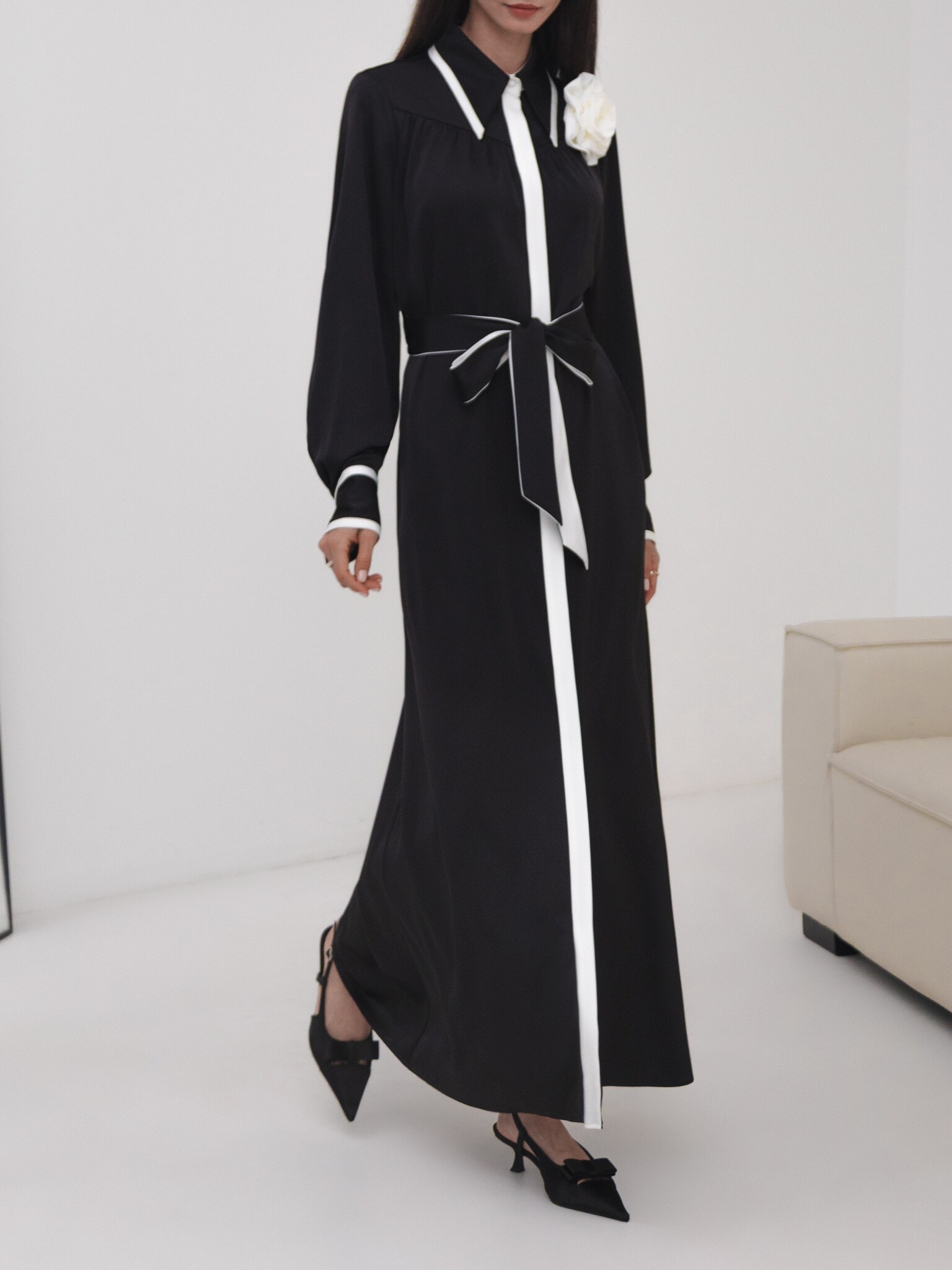 Maxi dress with contrasting inserts and flower brooch