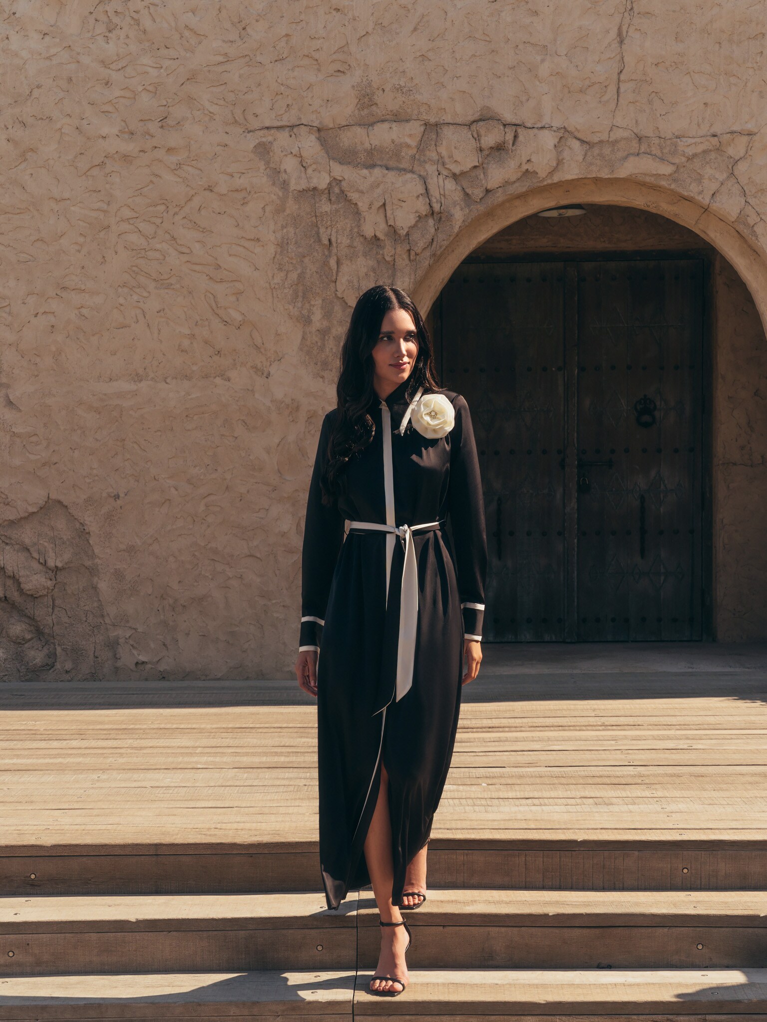 Maxi dress with contrasting inserts and flower brooch