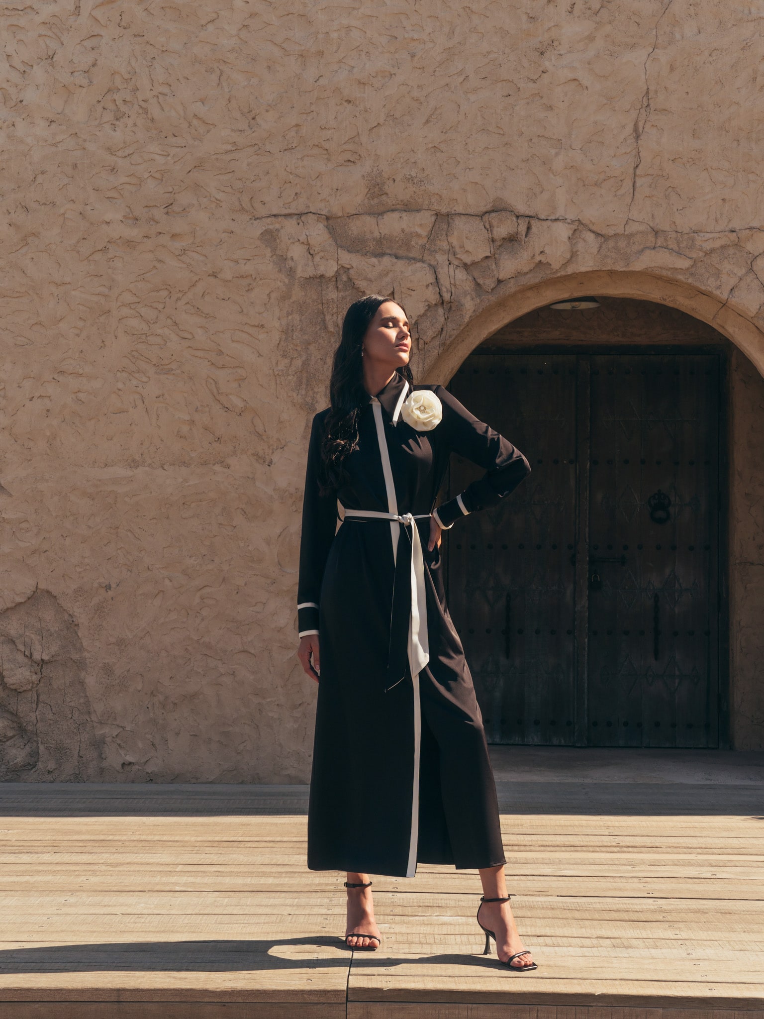 Maxi dress with contrasting inserts and flower brooch
