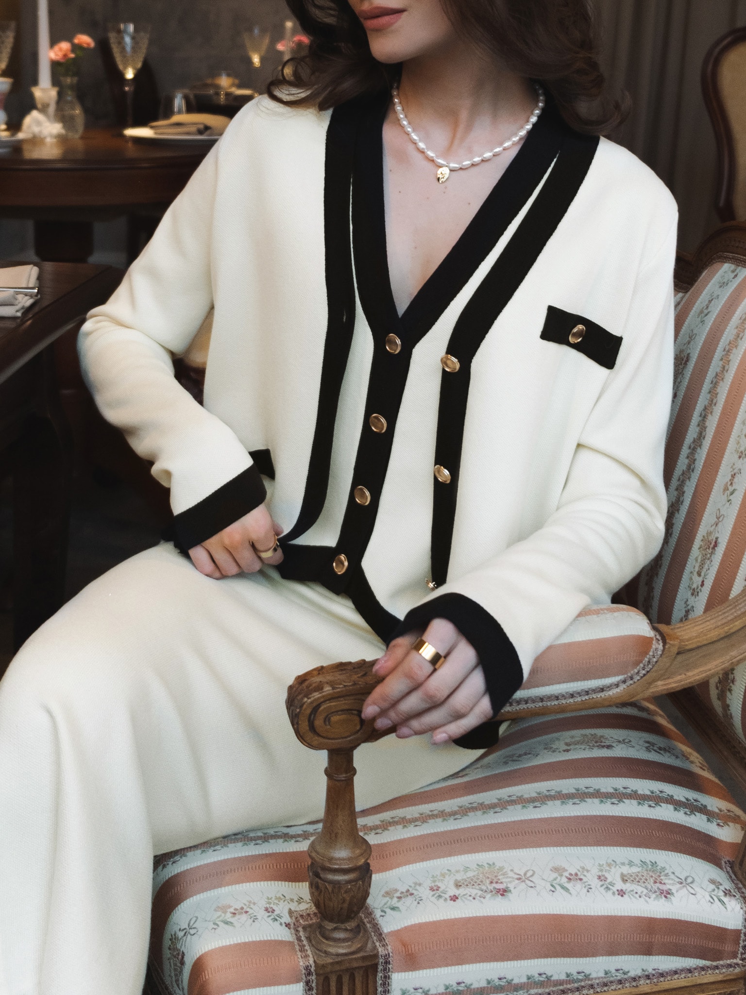 Knitted cardigan with golden buttons