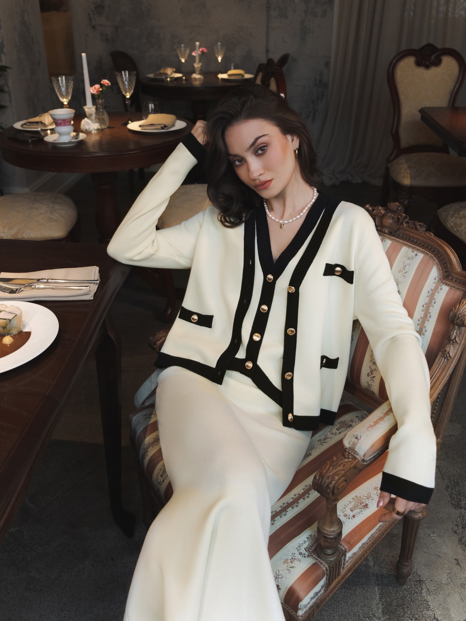 Knitted cardigan with golden buttons