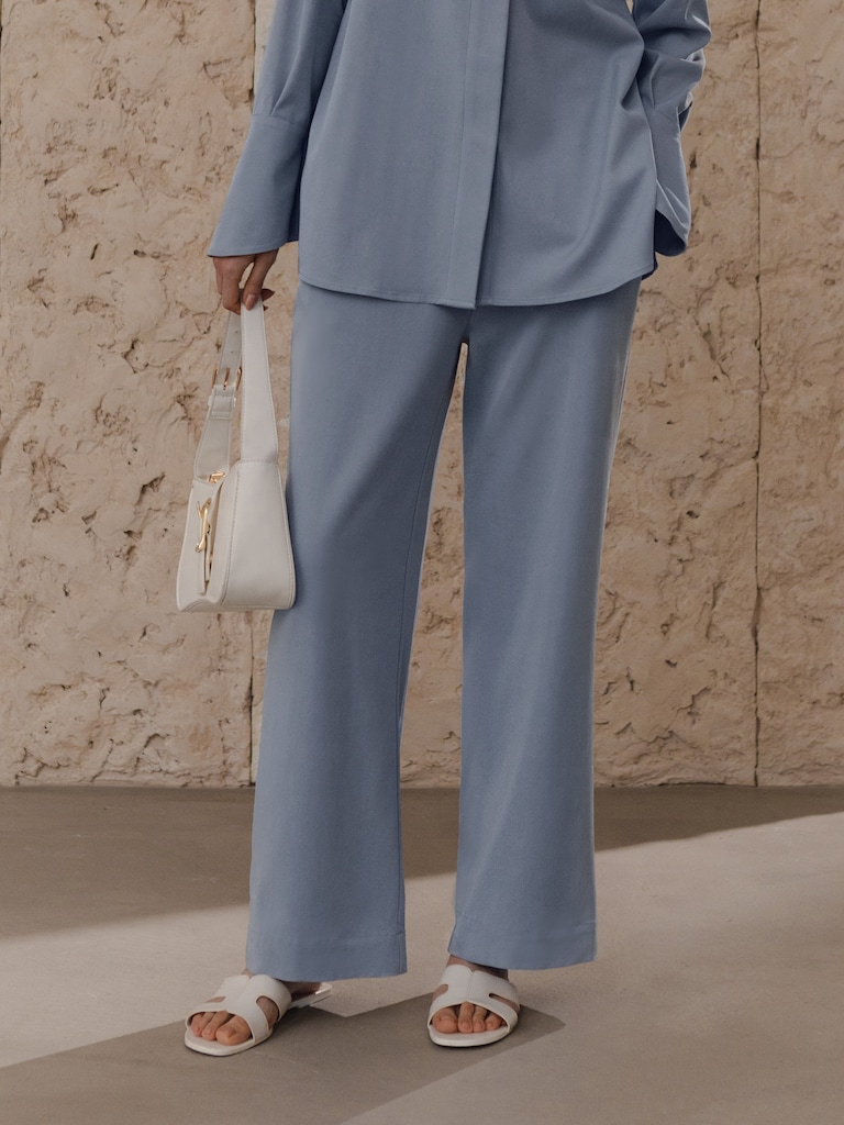 Straight trousers with elasticated waistband