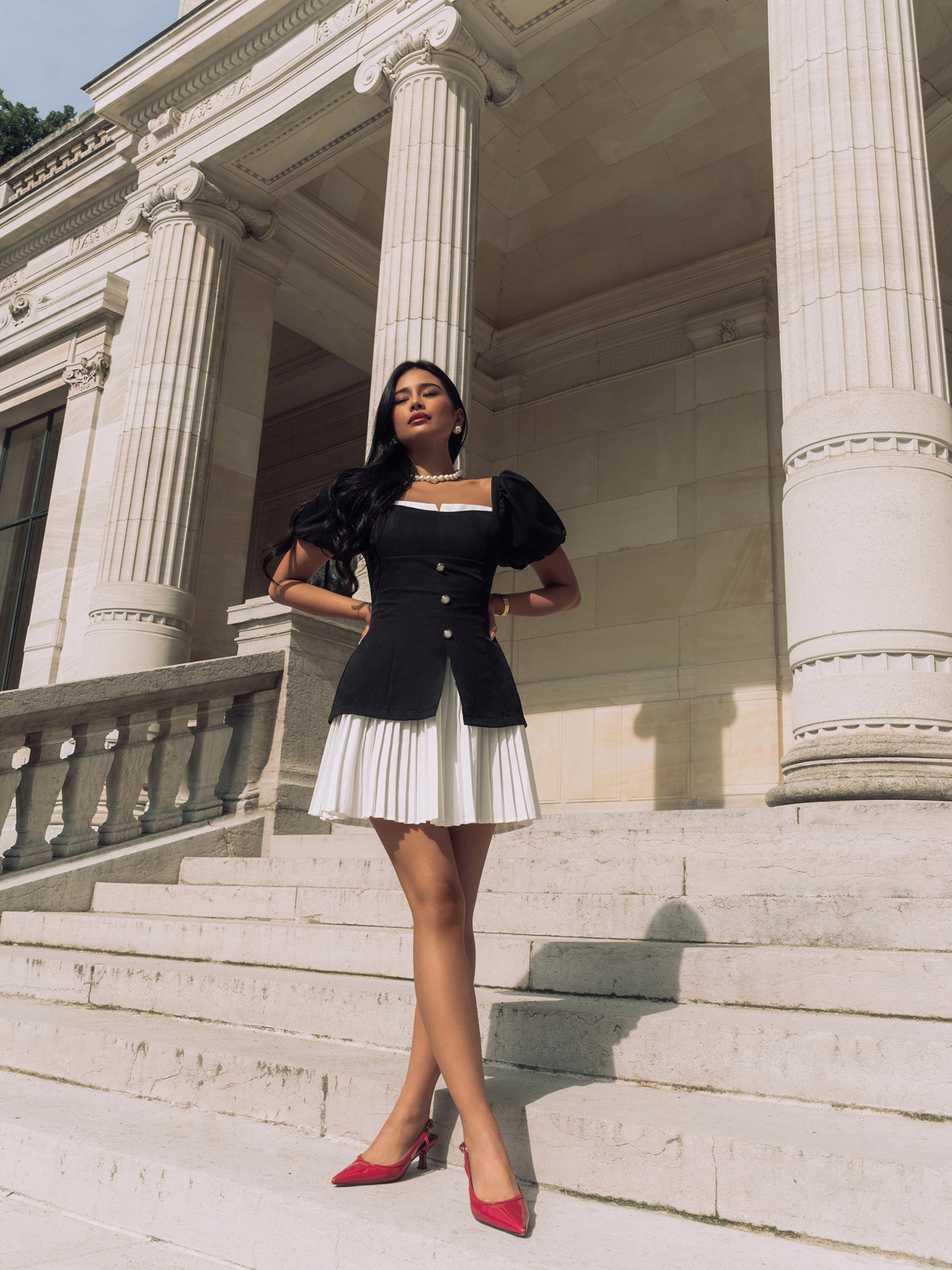 Fitted mini dress with pleated skirt