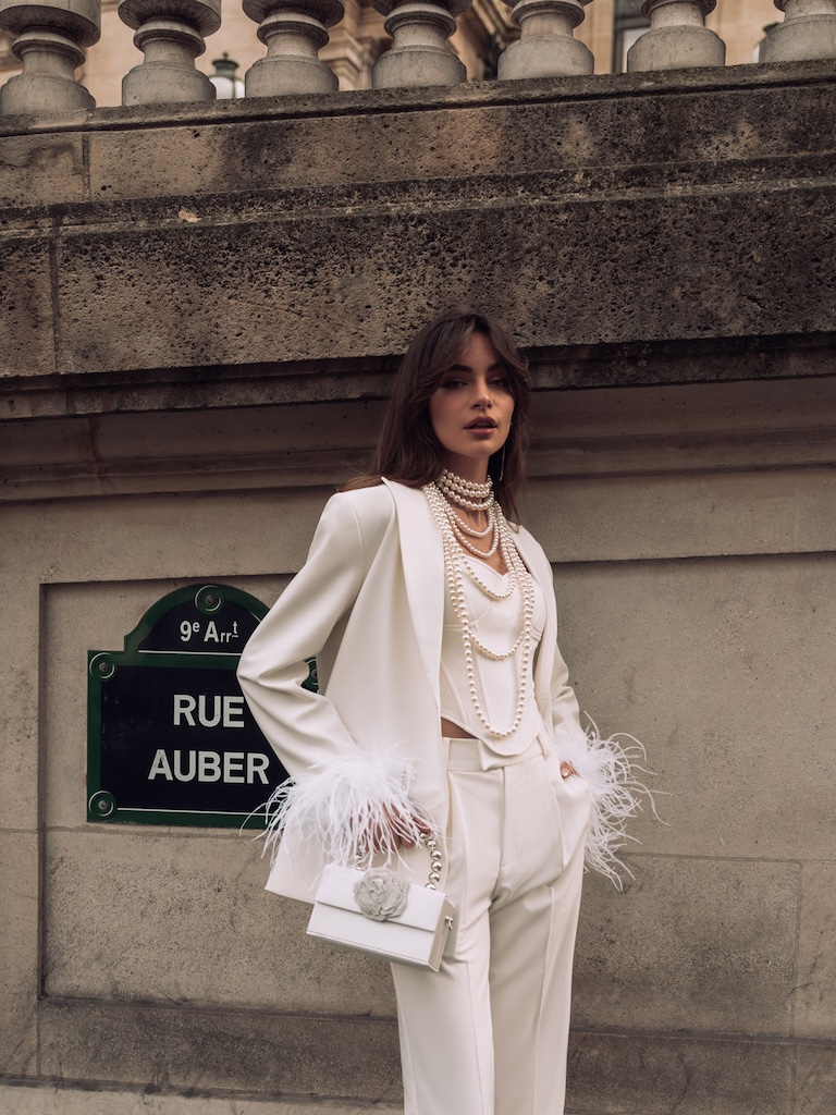 Single-breasted jacket with feathers on the cuffs