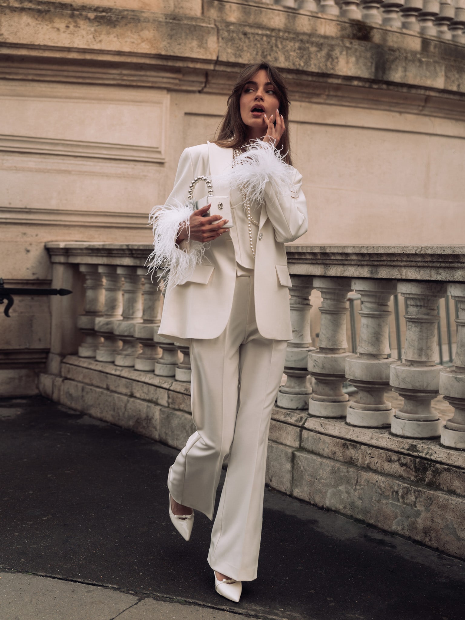 Single-breasted jacket with feathers on the cuffs