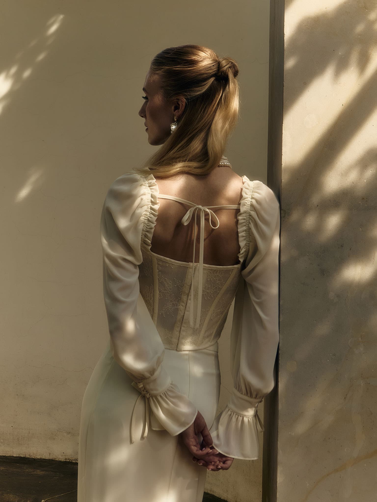 Corset blouse with lace waistband and tie-up cuffs