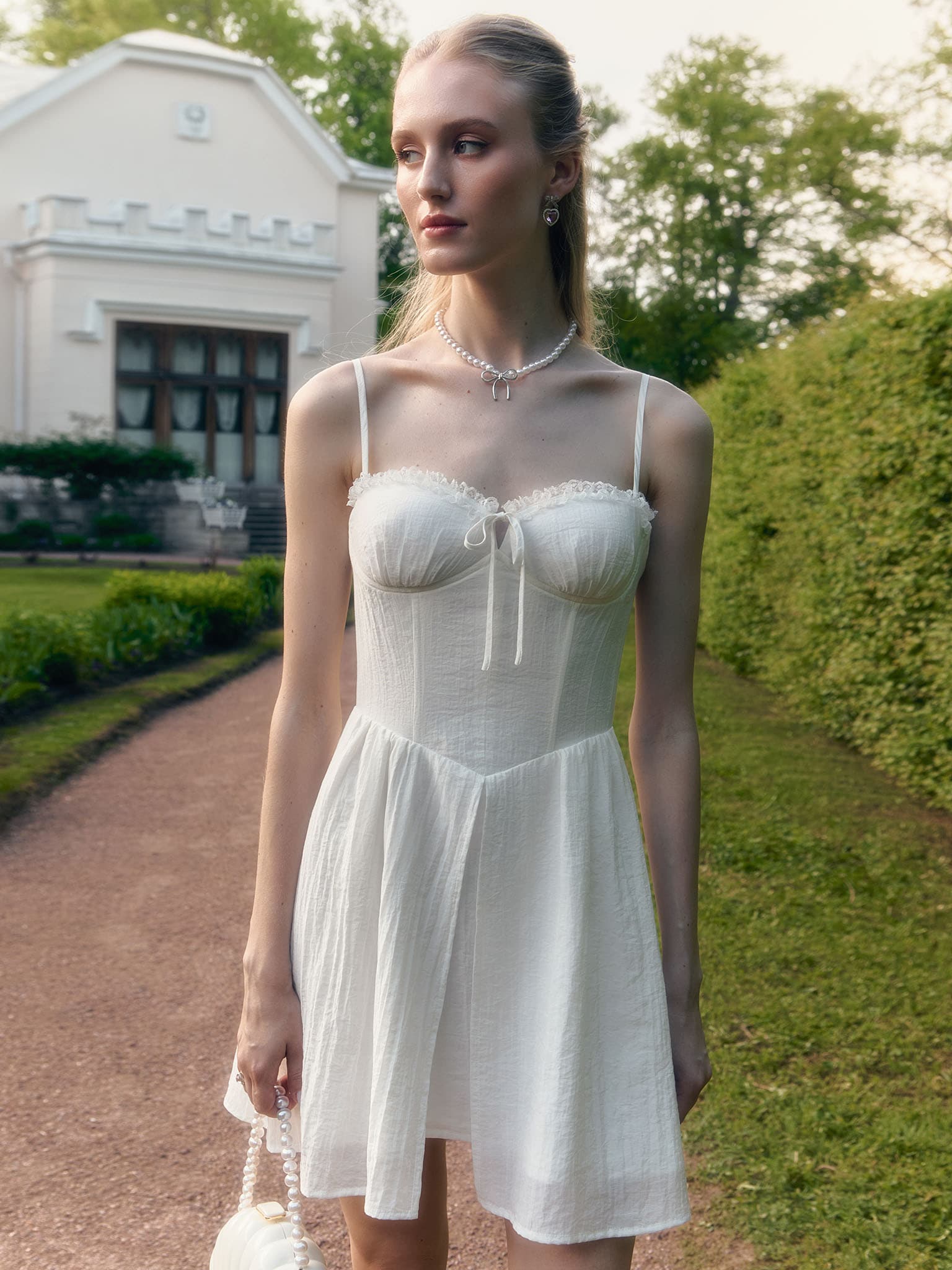 Mini strappy dress with lace ruffles on the bodice