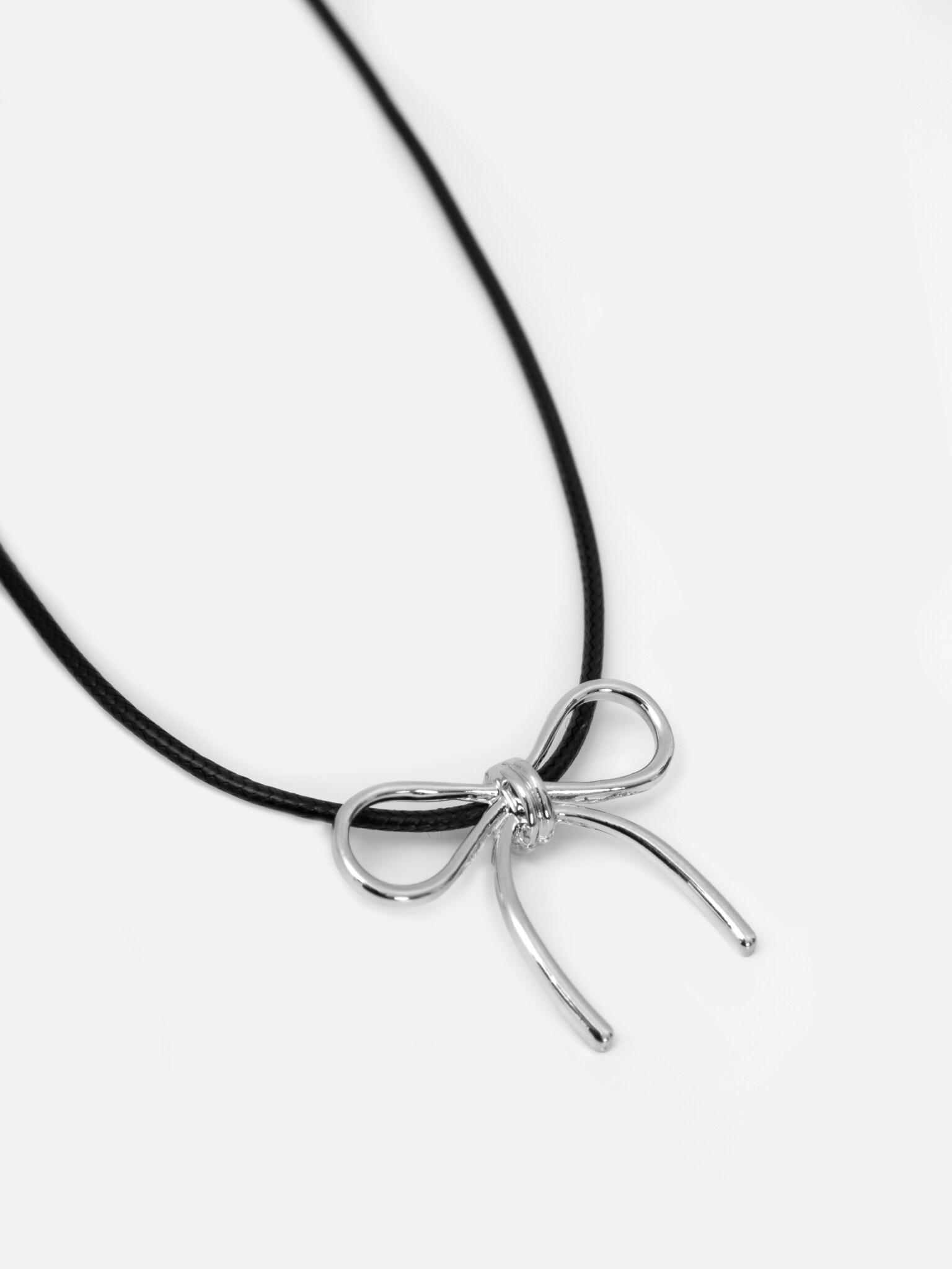 Thread with bow pendant