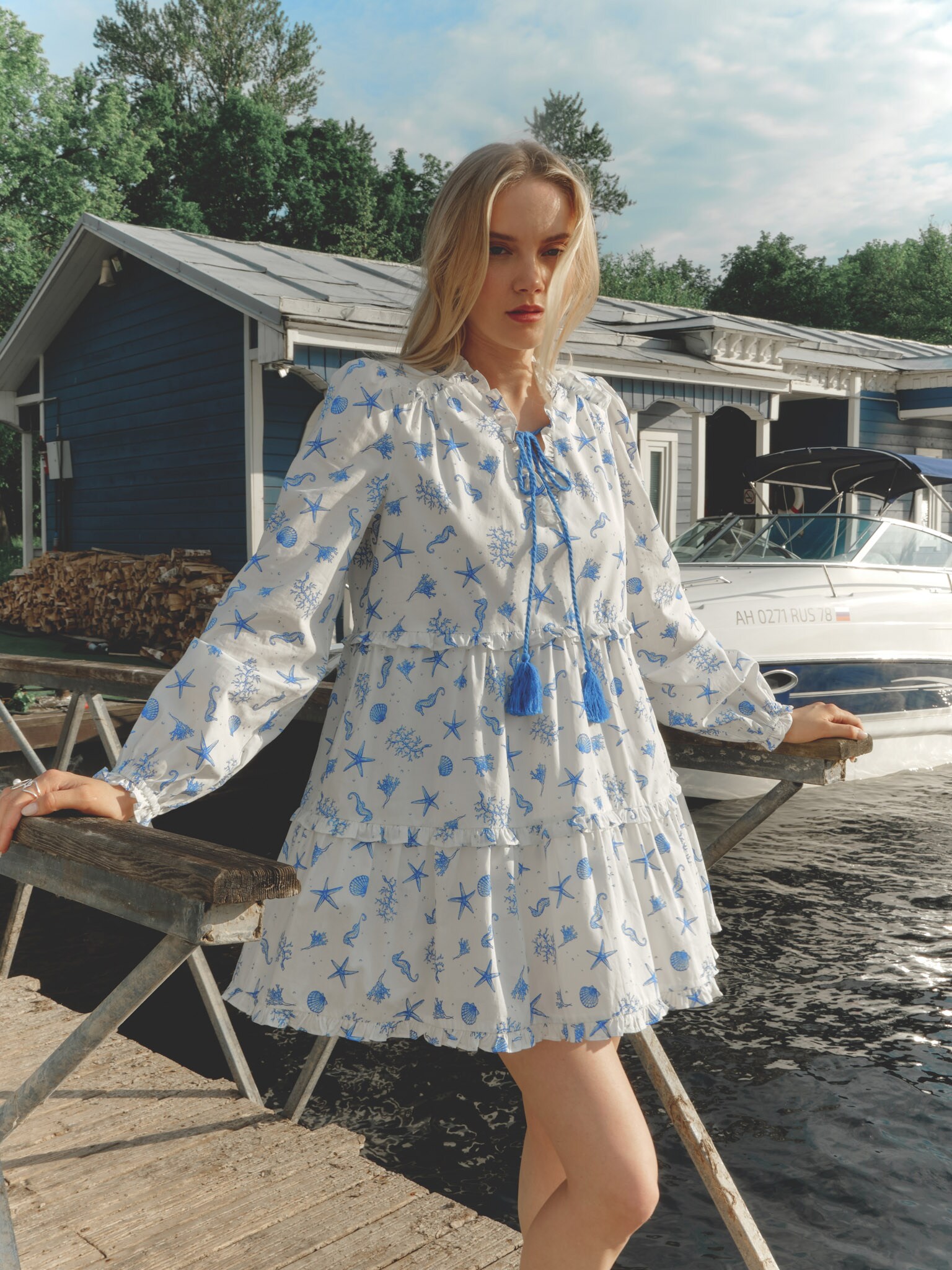 Layered mini dress with vibrant ties at the collar