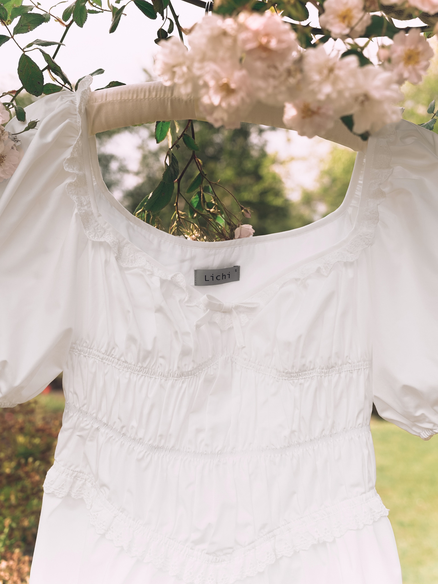 Mini dress with elasticated waist and lace ruffles