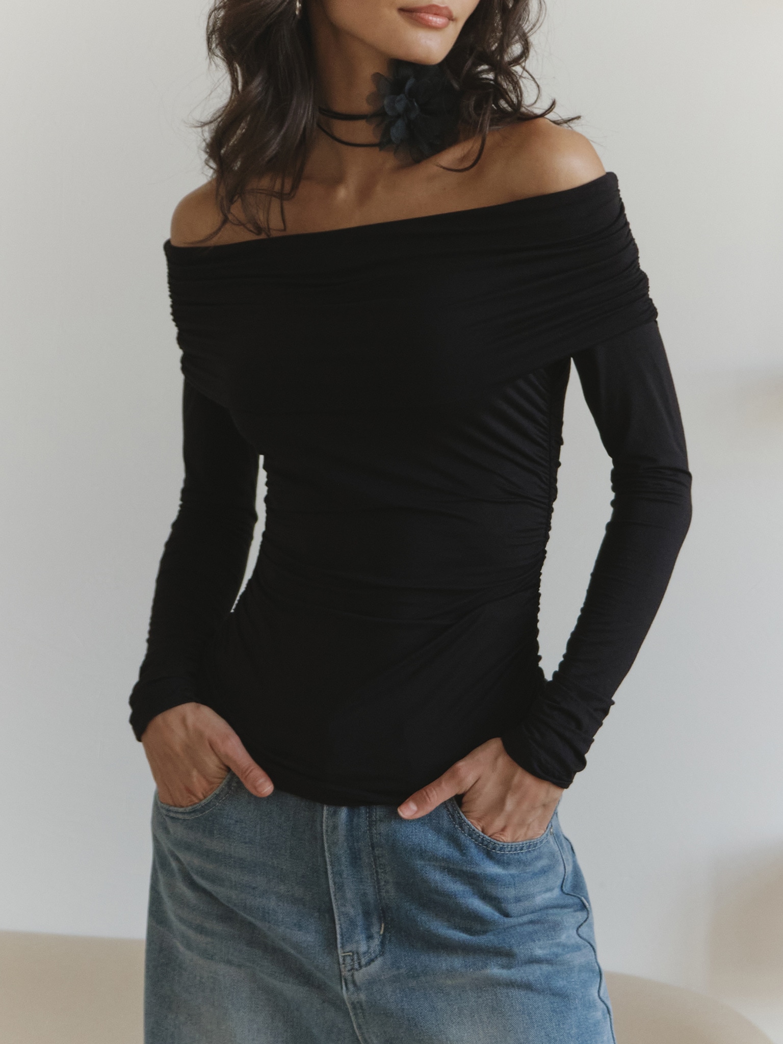 Top with open shoulders and draping on bodice