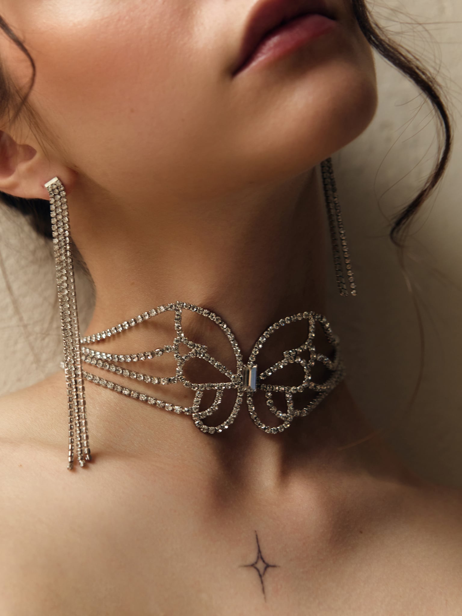 Rhinestone choker with butterfly decoration