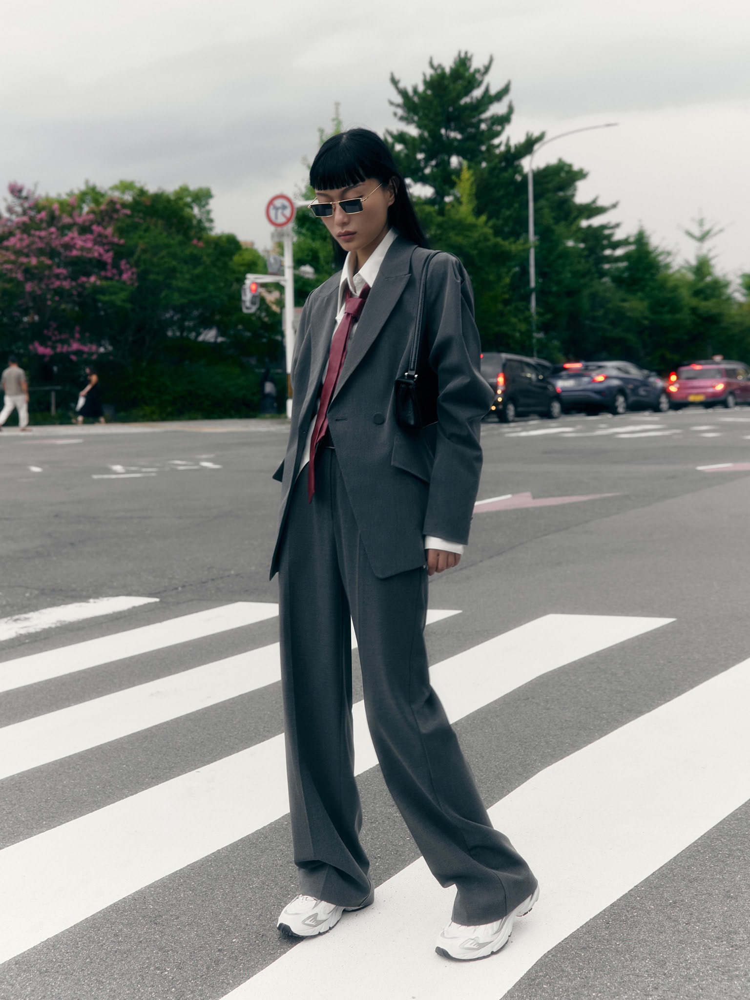 Straight suiting trousers with stitched creases and a belt