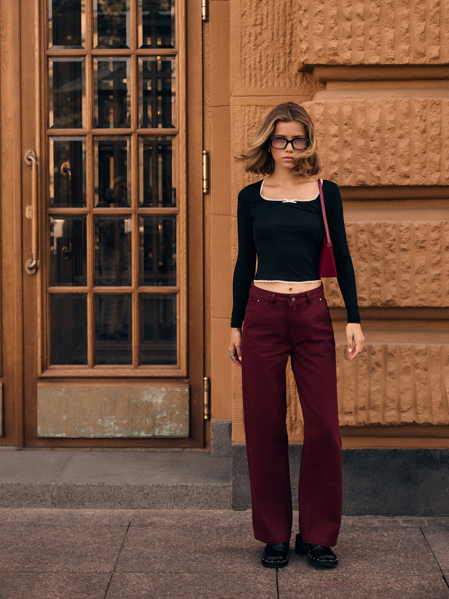 T-shirt manches longues en maille avec galon ajouré et nœud sur le col