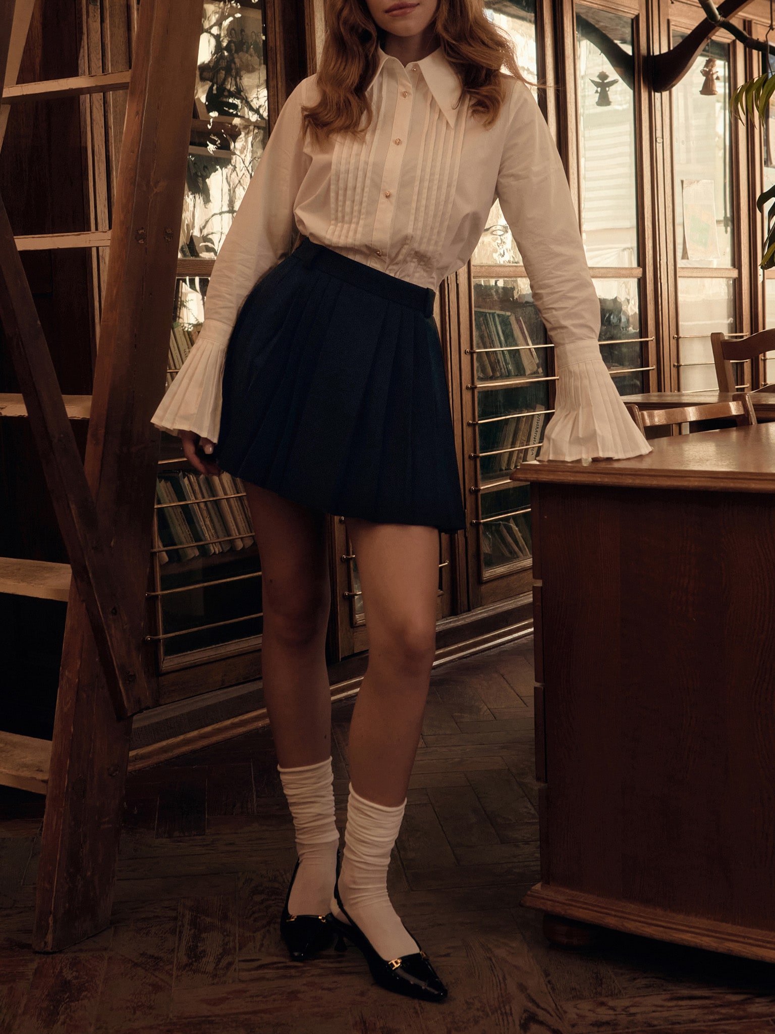 Shirt with pleated cuffs and metal buttons