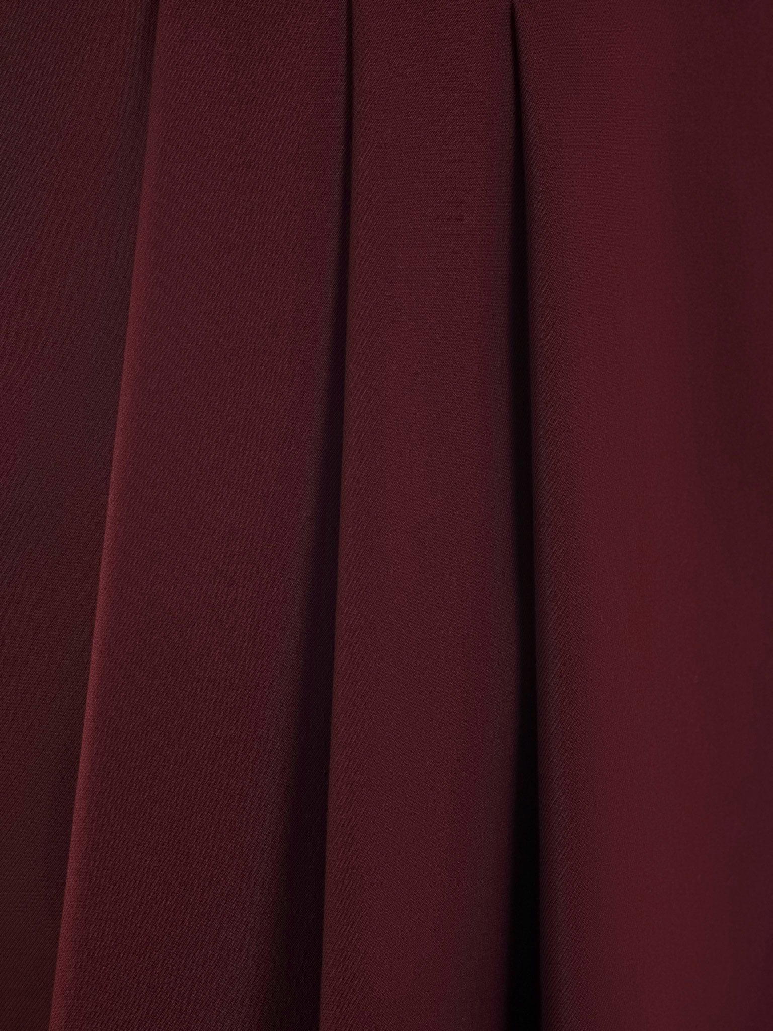 Mini skirt with large pleats on the sides and a belt