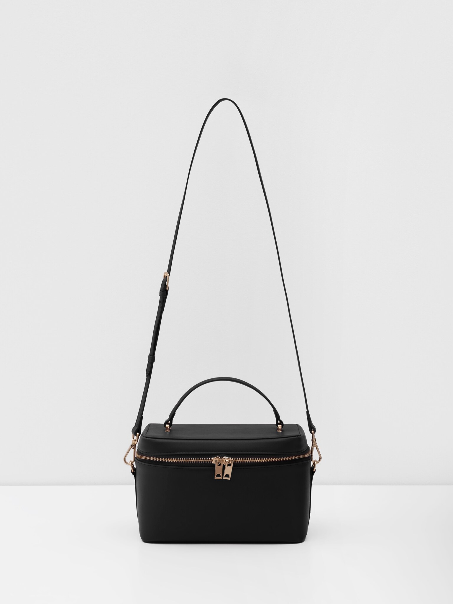 Miniature rigid-shaped shoulder bag