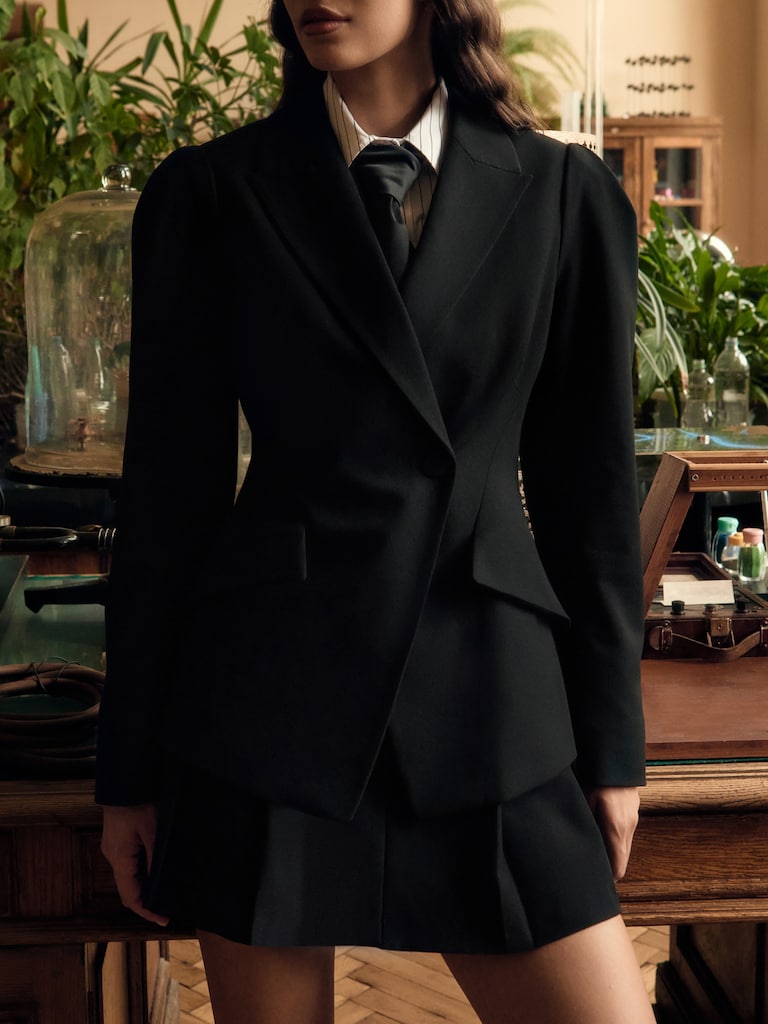 Flared jacket with voluminous sleeves