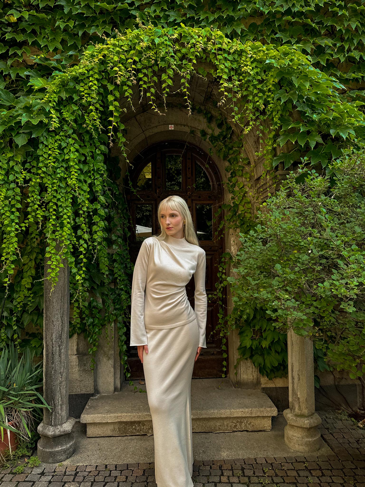 Knitted jumper with draperies