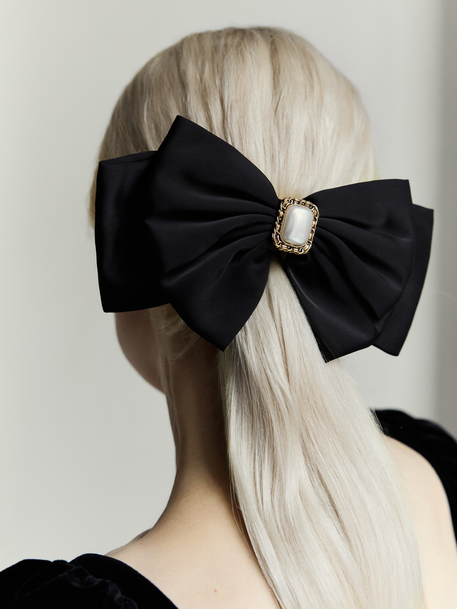 Satin hair bow with centre decoration