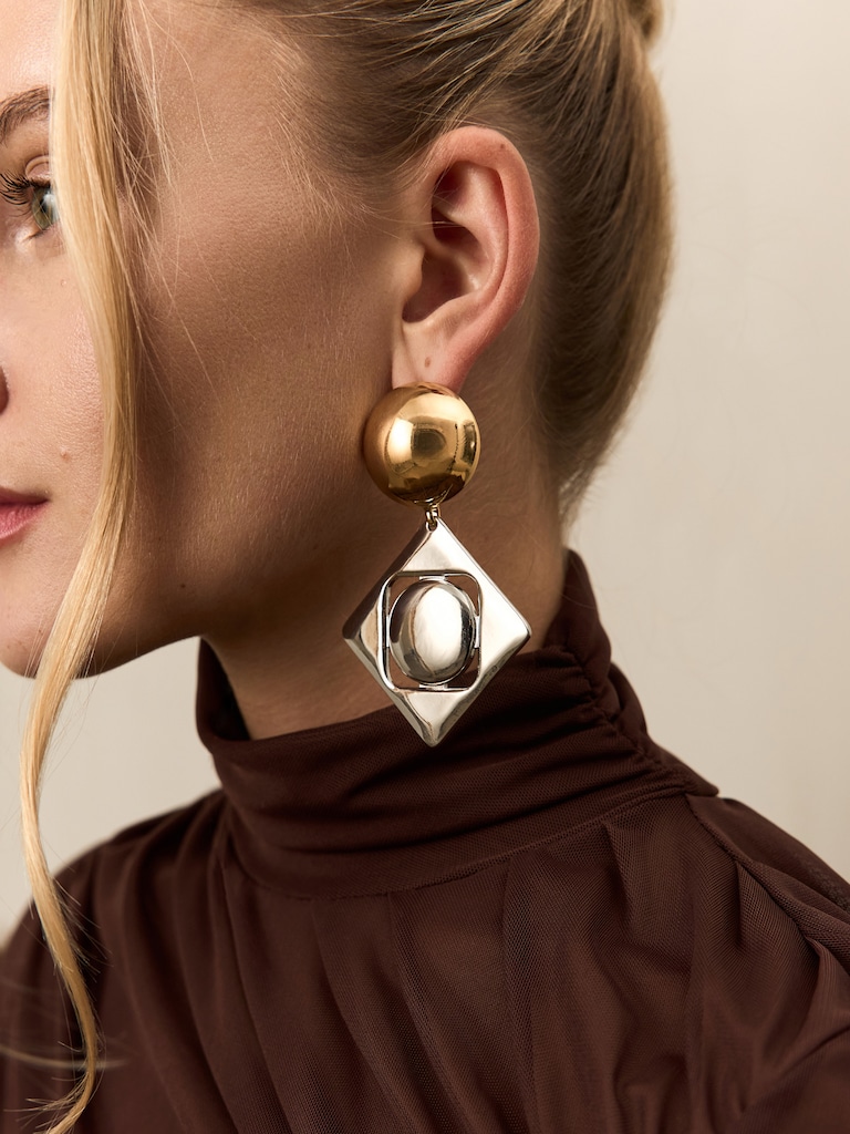 Geometric stud earrings in two metals