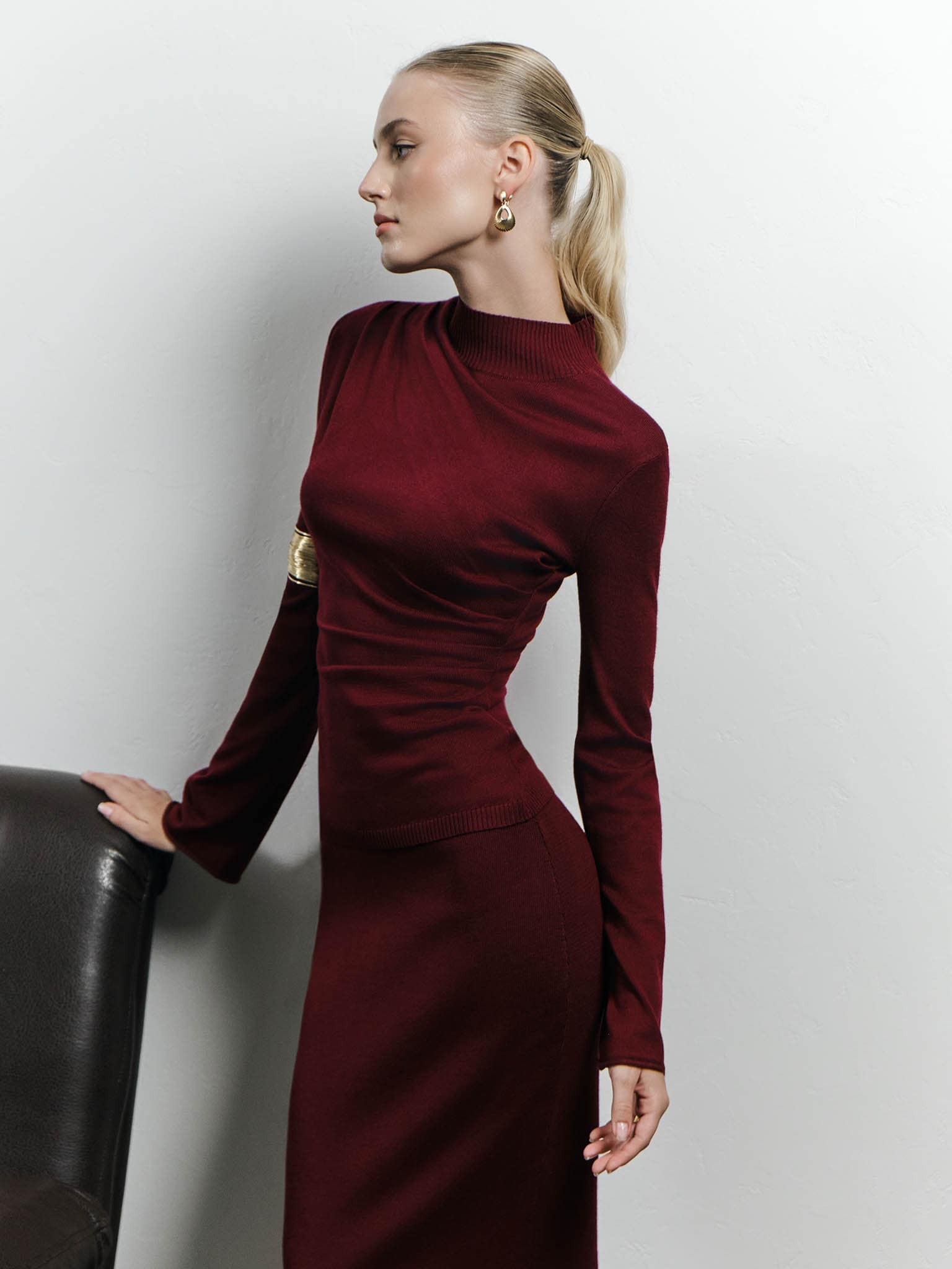 Knitted jumper with draperies