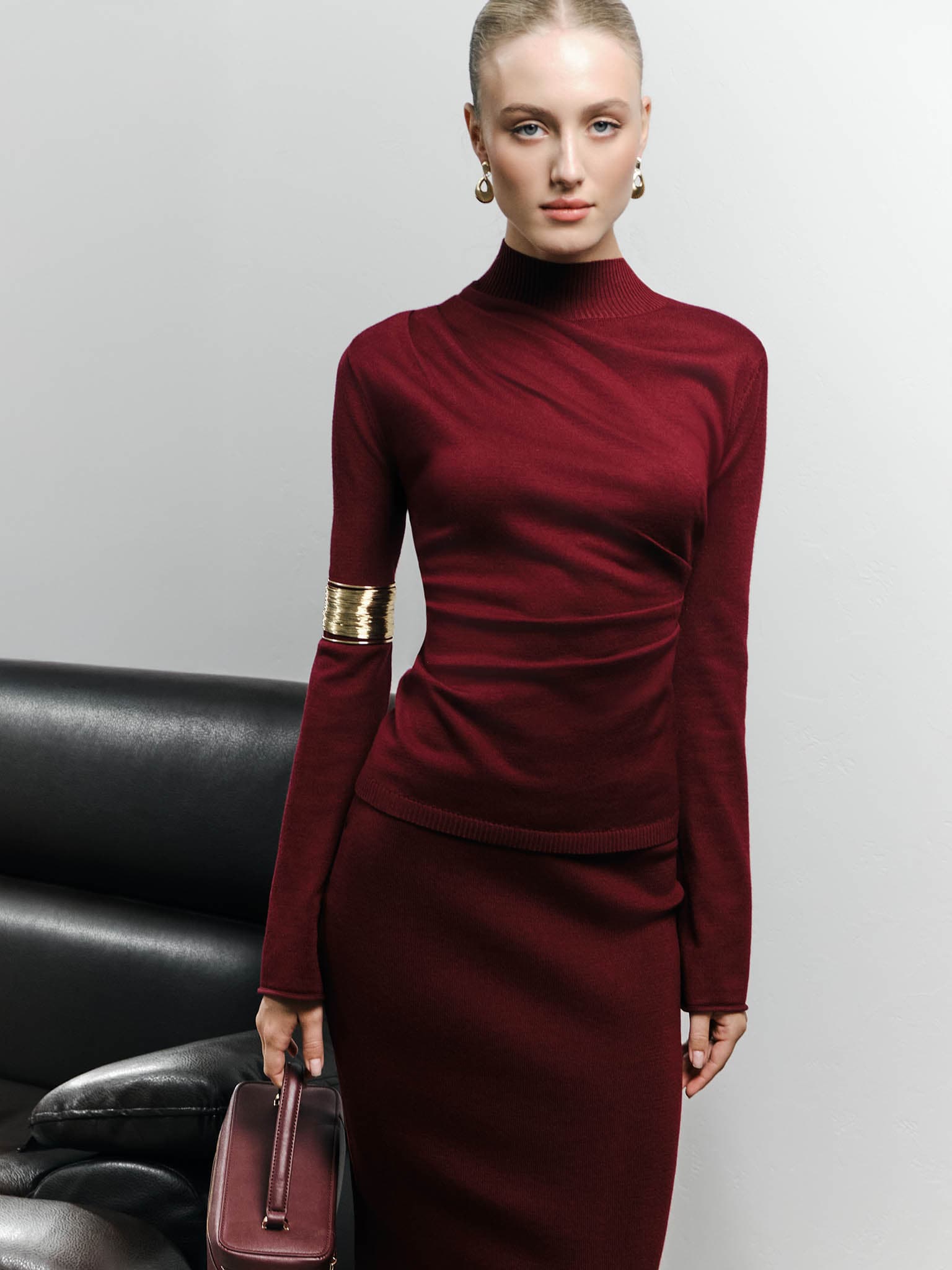 Knitted jumper with draperies