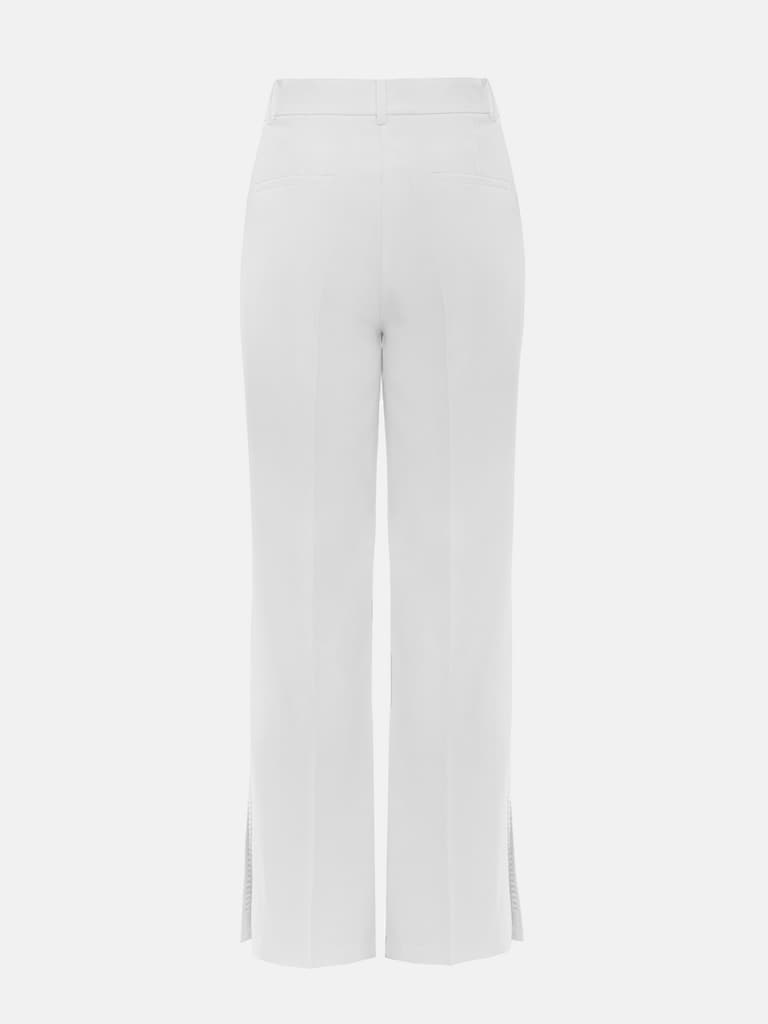 Pantalon avec fentes sur les jambes et décorations argentées