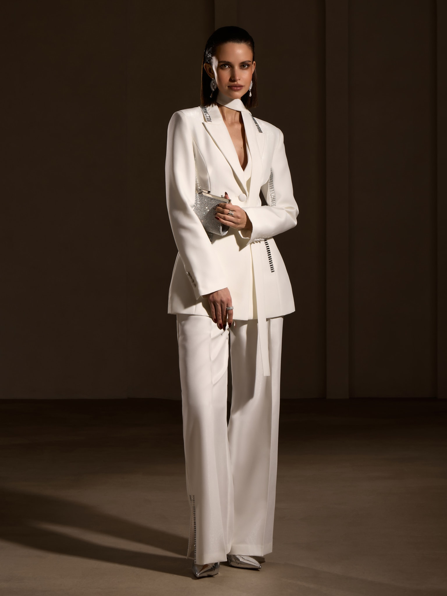 Trousers with slits on the pant legs and silvertone decor