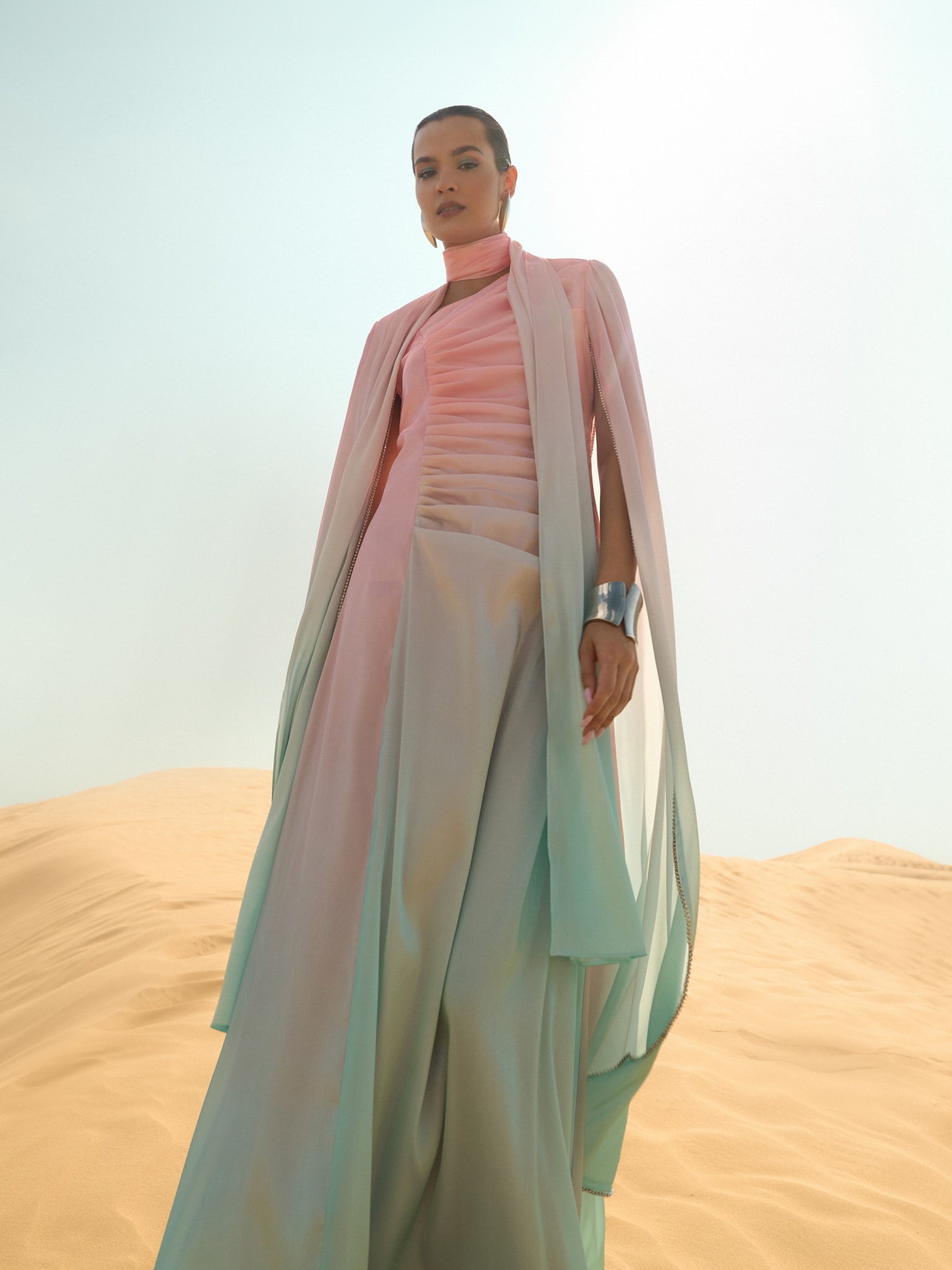 Maxi dress with asymmetric neckline and rhinestone embellishment on the sleeves