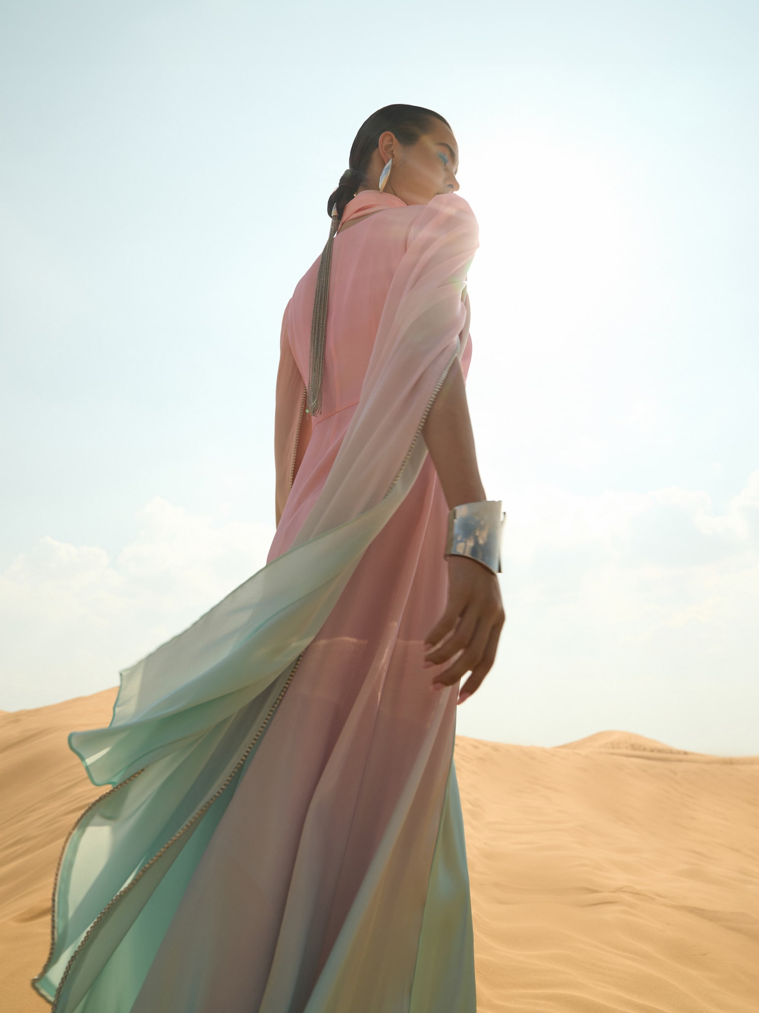 Maxi dress with asymmetric neckline and rhinestone embellishment on the sleeves