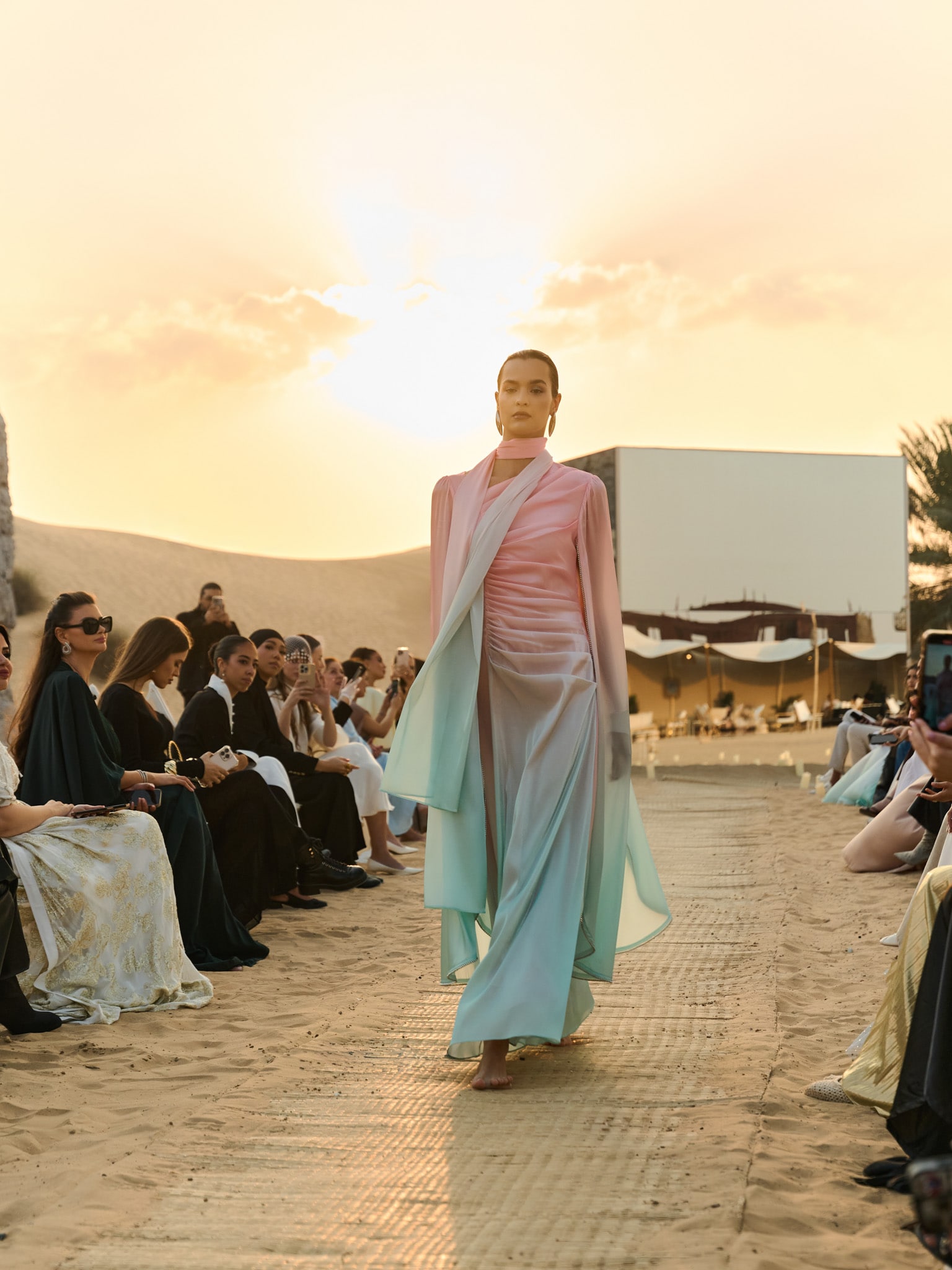 Maxi dress with asymmetric neckline and rhinestone embellishment on the sleeves