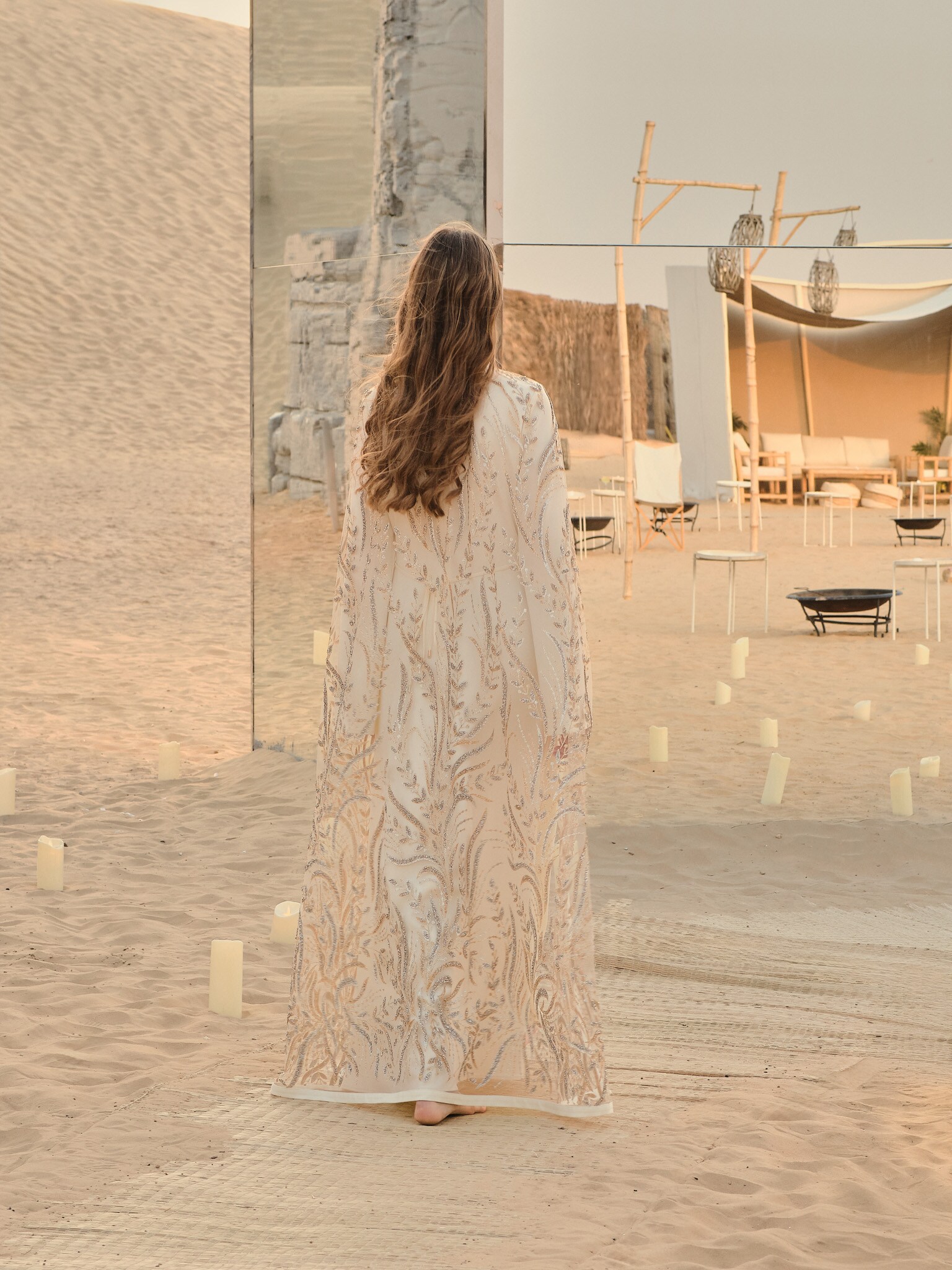 Translucent floor-length cape with glittering pattern