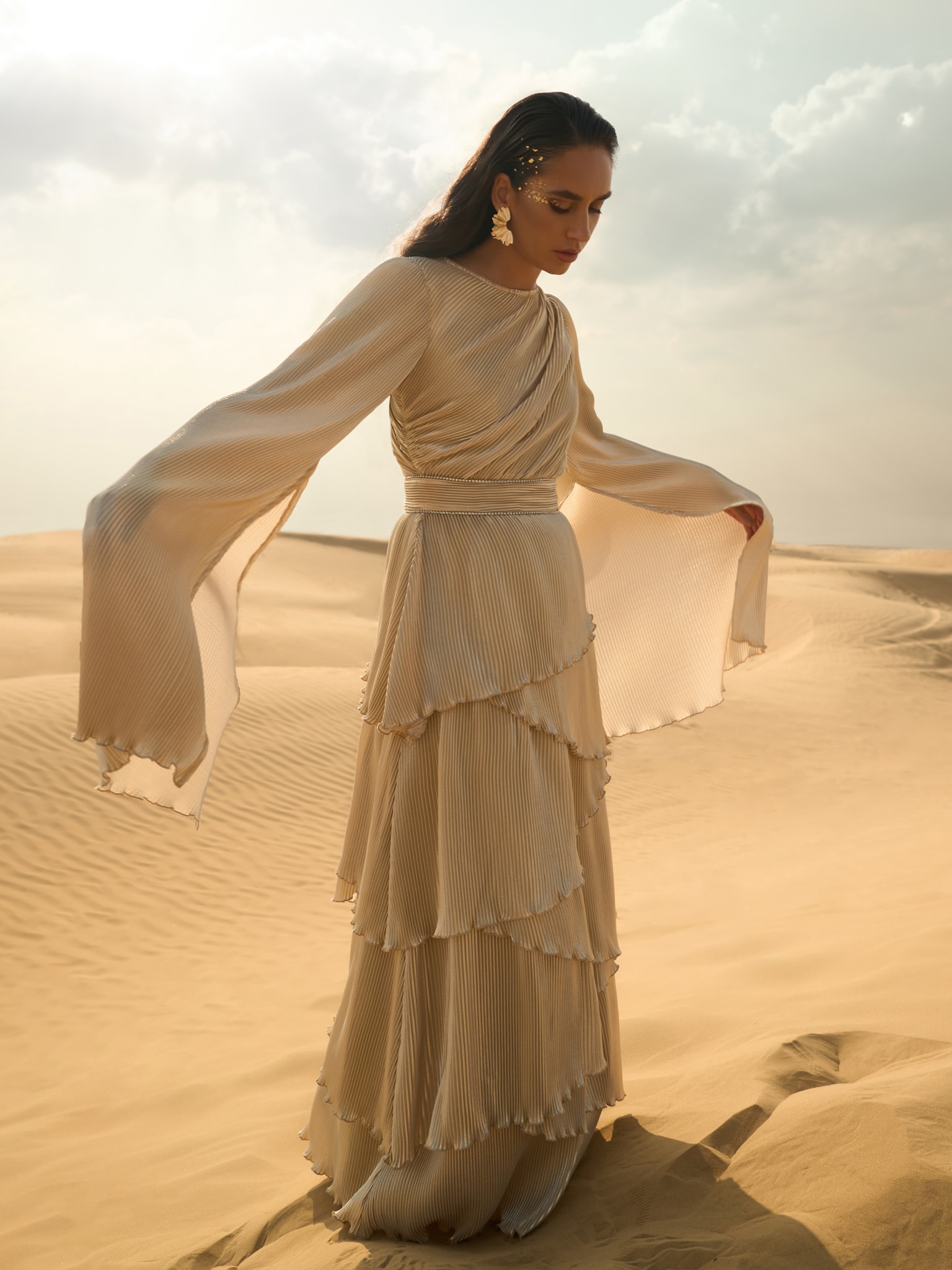 Pleated maxi dress with layered skirt and rhinestone decor at the waist