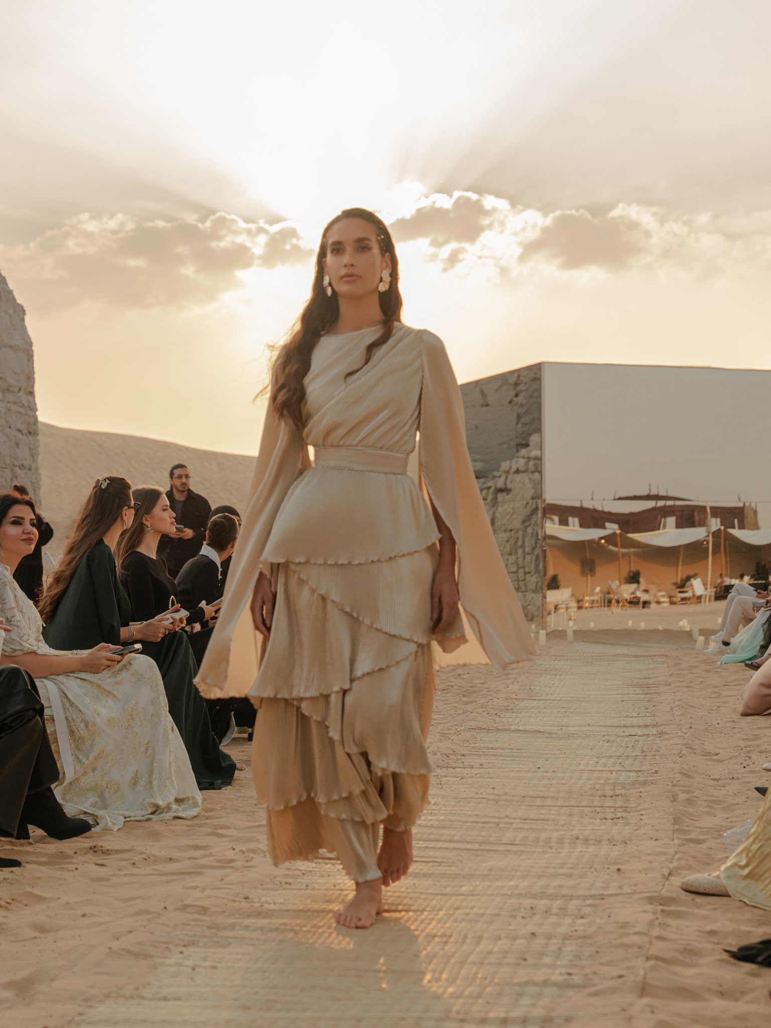 Pleated maxi dress with layered skirt and rhinestone decor at the waist