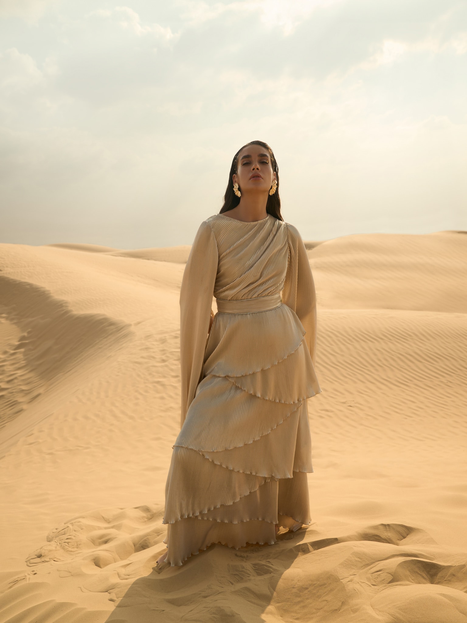 Pleated maxi dress with layered skirt and rhinestone decor at the waist