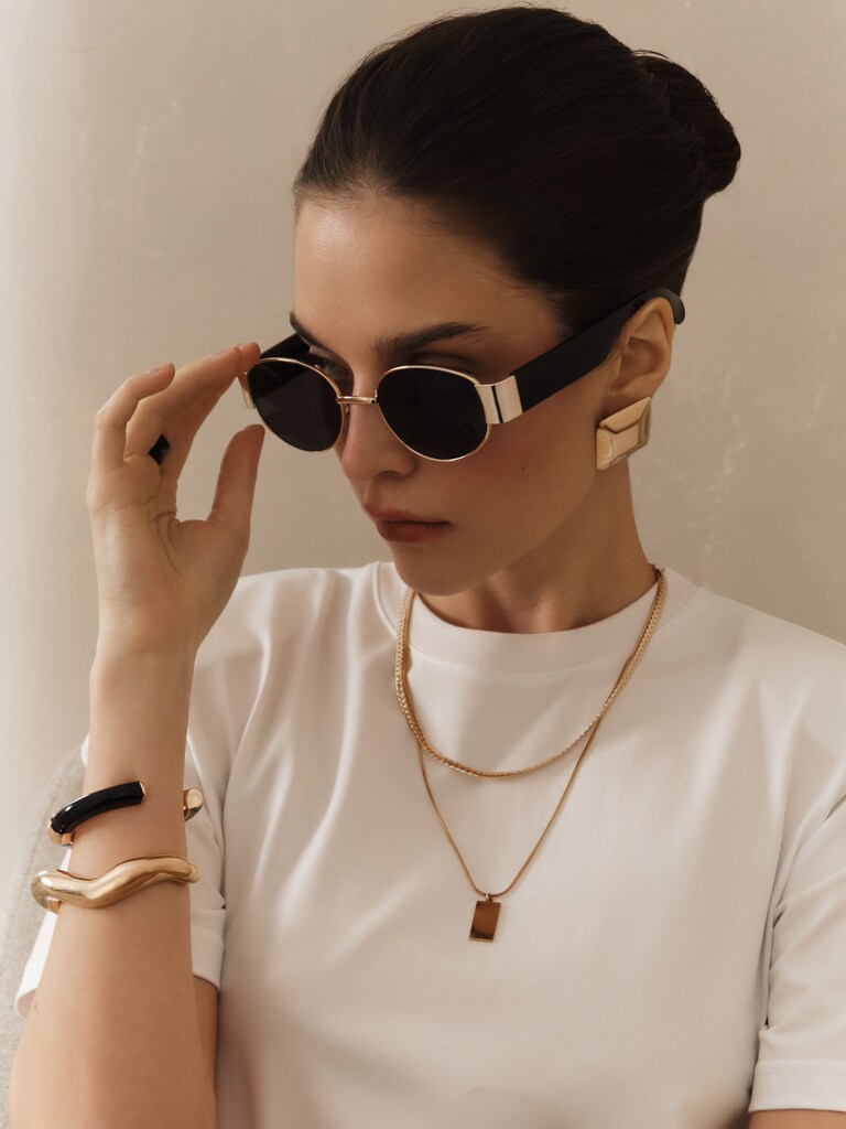 Wide-framed sunglasses with metal decorations