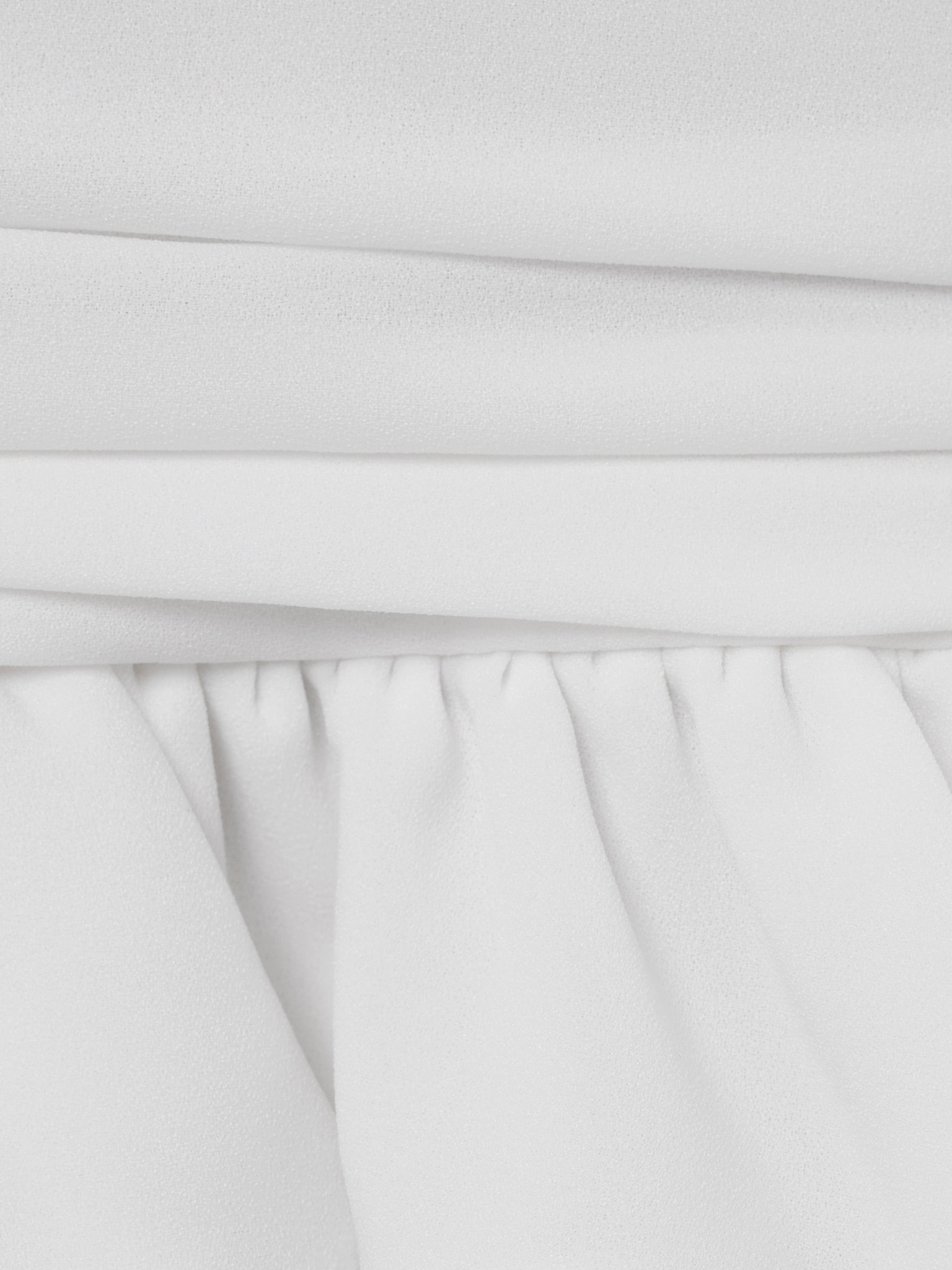 Voluminous mini dress with ruffles on the skirt and ribbon scarf