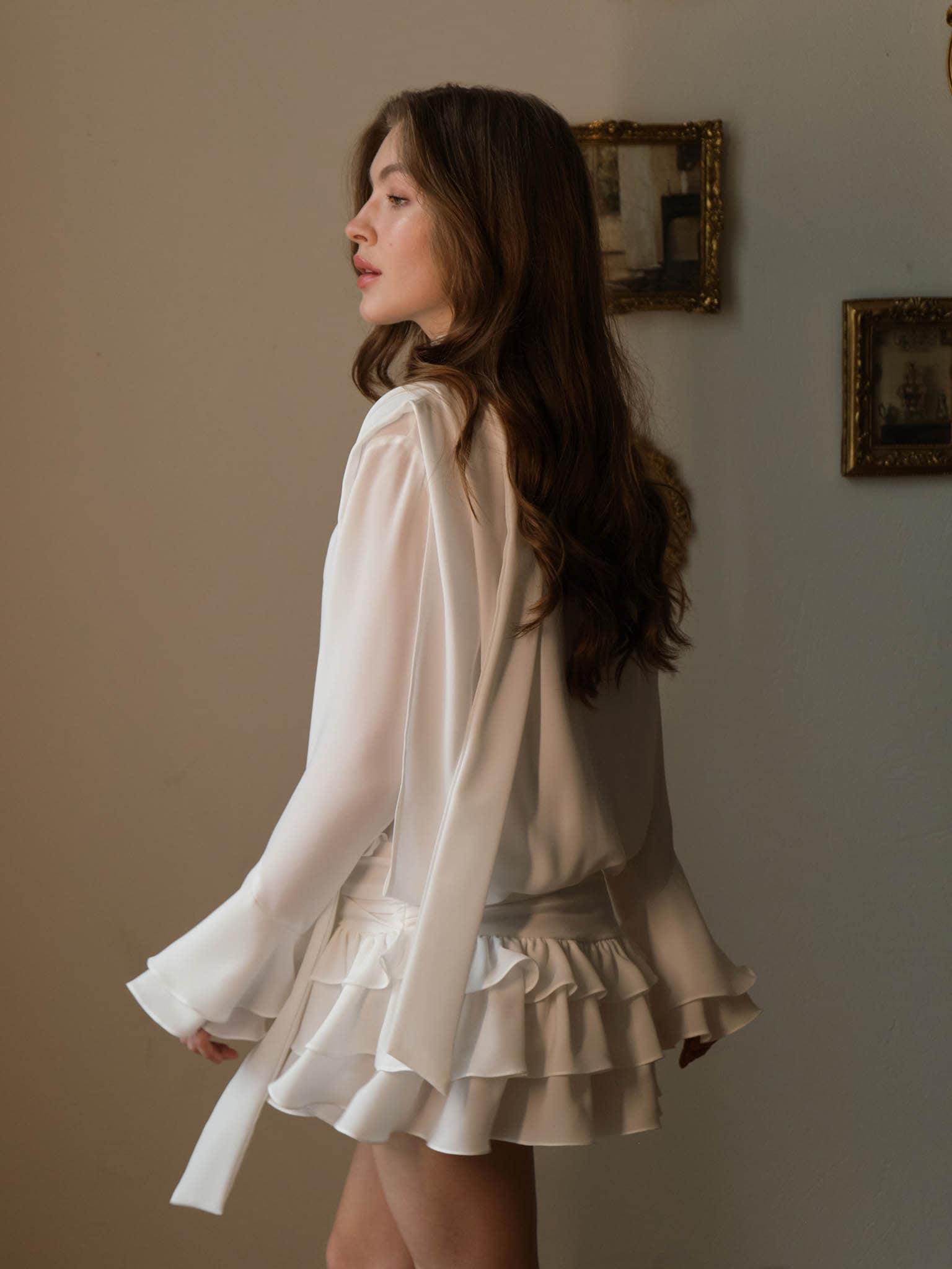 Voluminous mini dress with ruffles on the skirt and ribbon scarf