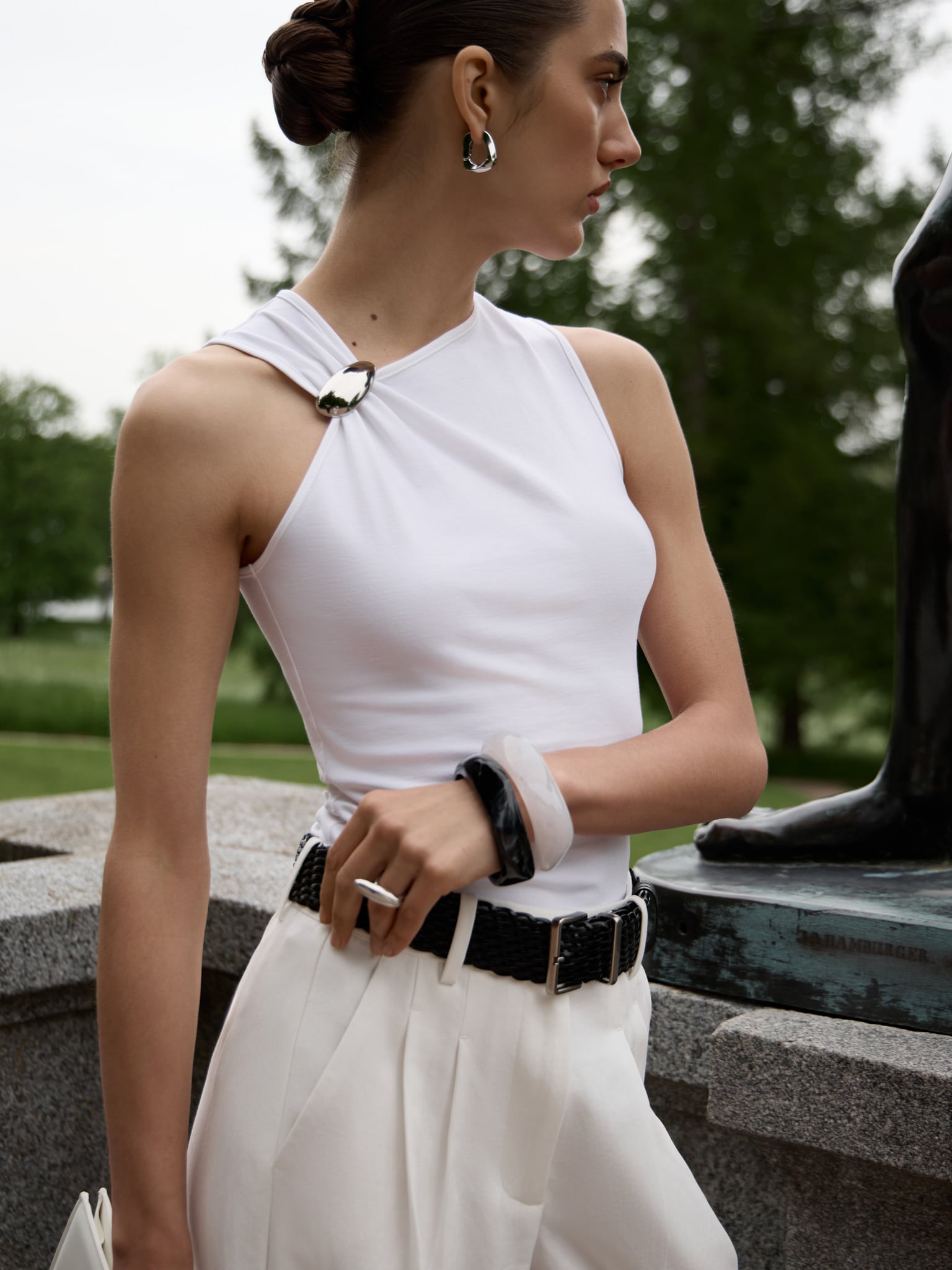 Top with asymmetrical straps and metal decorations