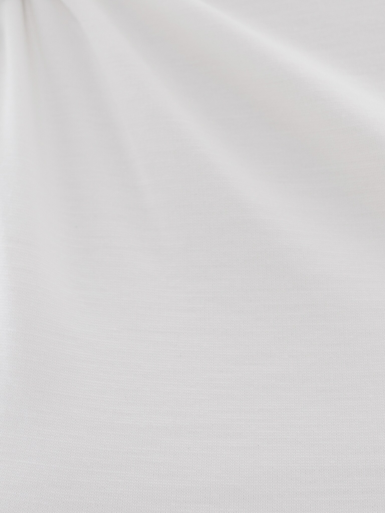 Top with asymmetrical straps and metal decorations